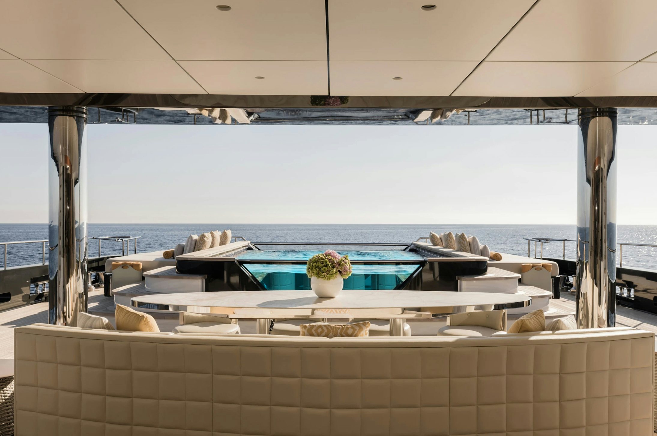 a room with a table and chairs aboard LOON Yacht for Charter