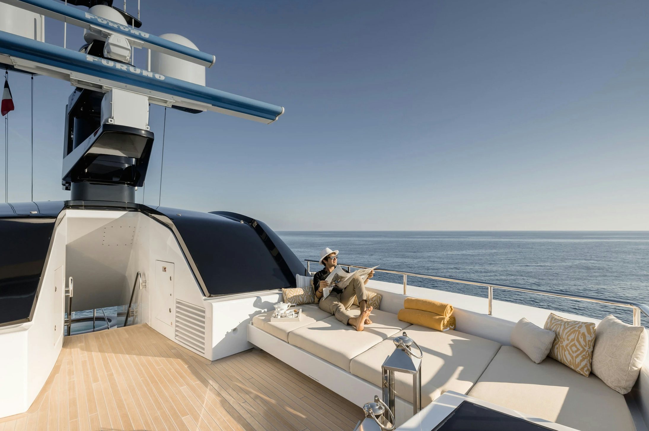 a person sitting on a boat aboard LOON Yacht for Charter