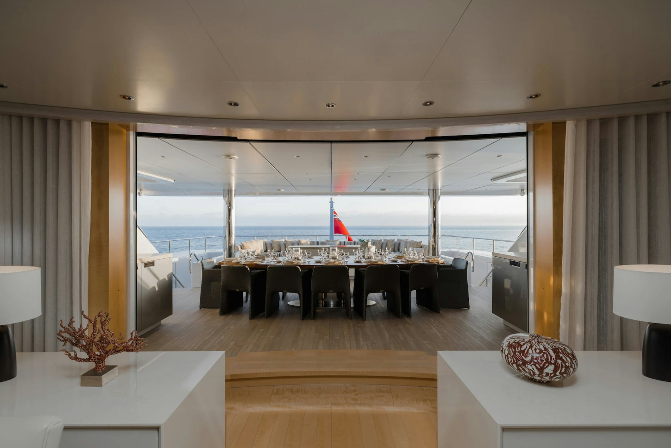 a large room with a large table and chairs aboard LOON Yacht for Charter