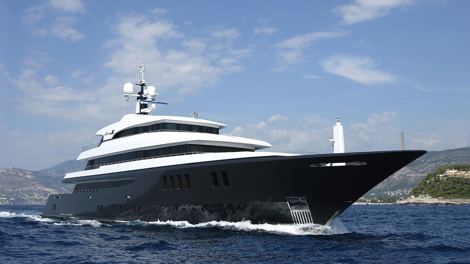 a large ship in the water aboard LOON Yacht for Charter