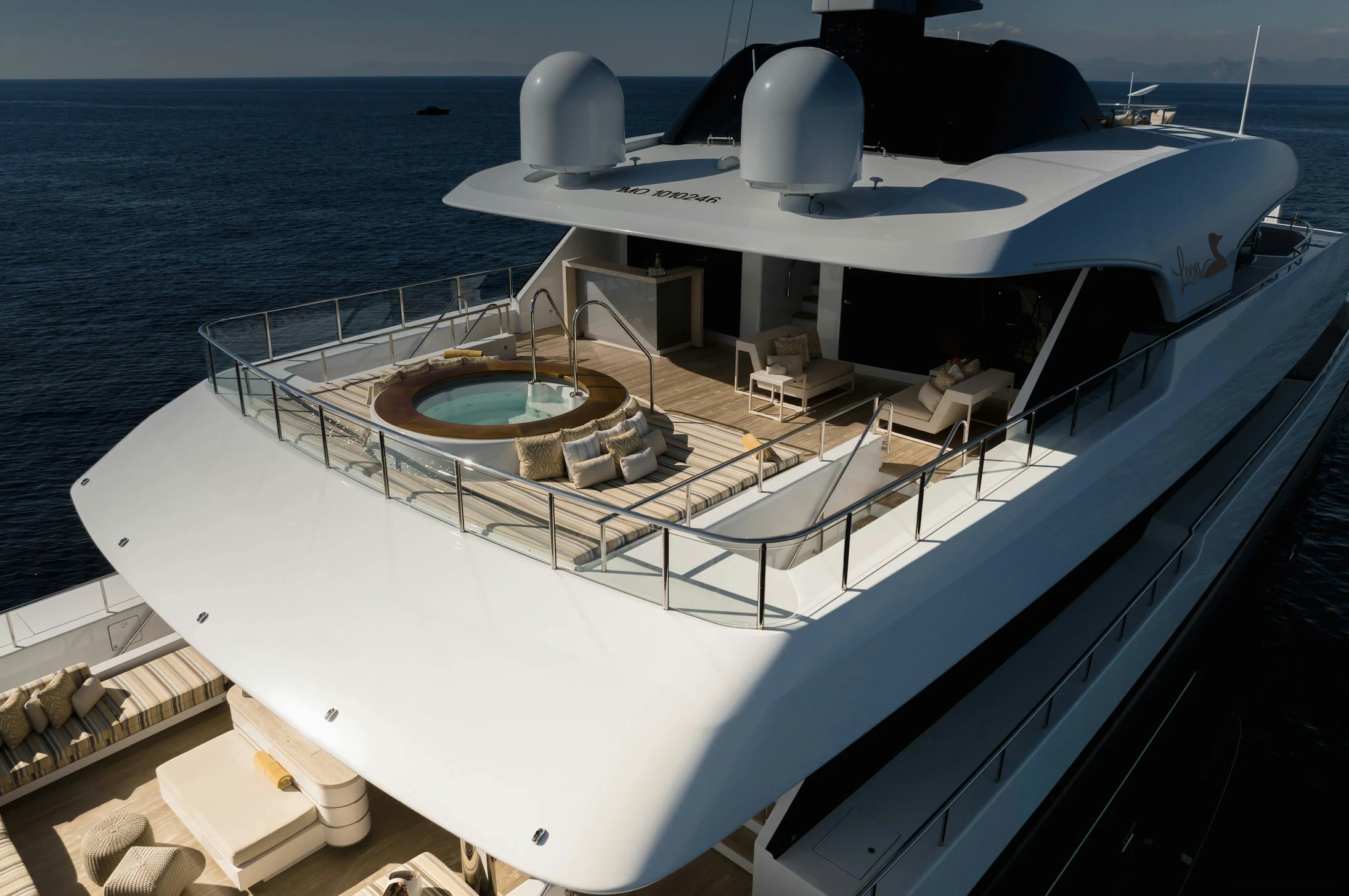 a large white boat on the water aboard LOON Yacht for Charter
