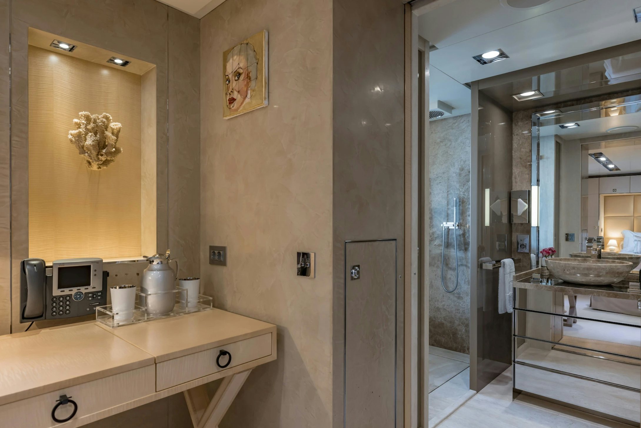 a bathroom with a sink and a shower unit aboard LOON Yacht for Charter