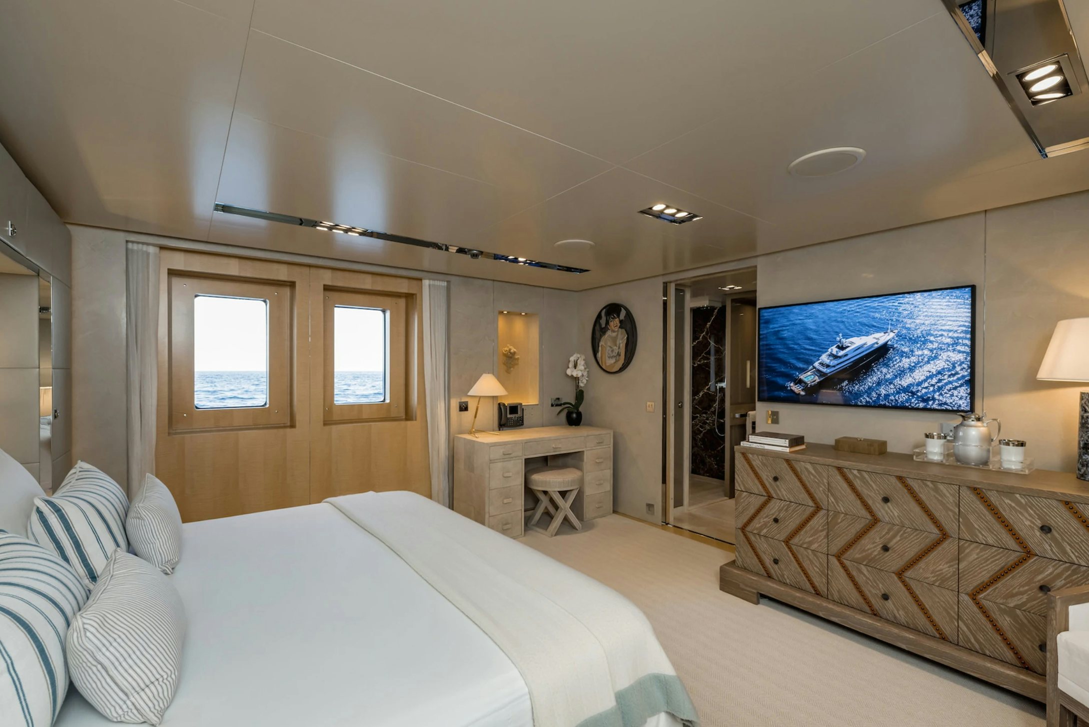 a bedroom with a large bed aboard LOON Yacht for Charter