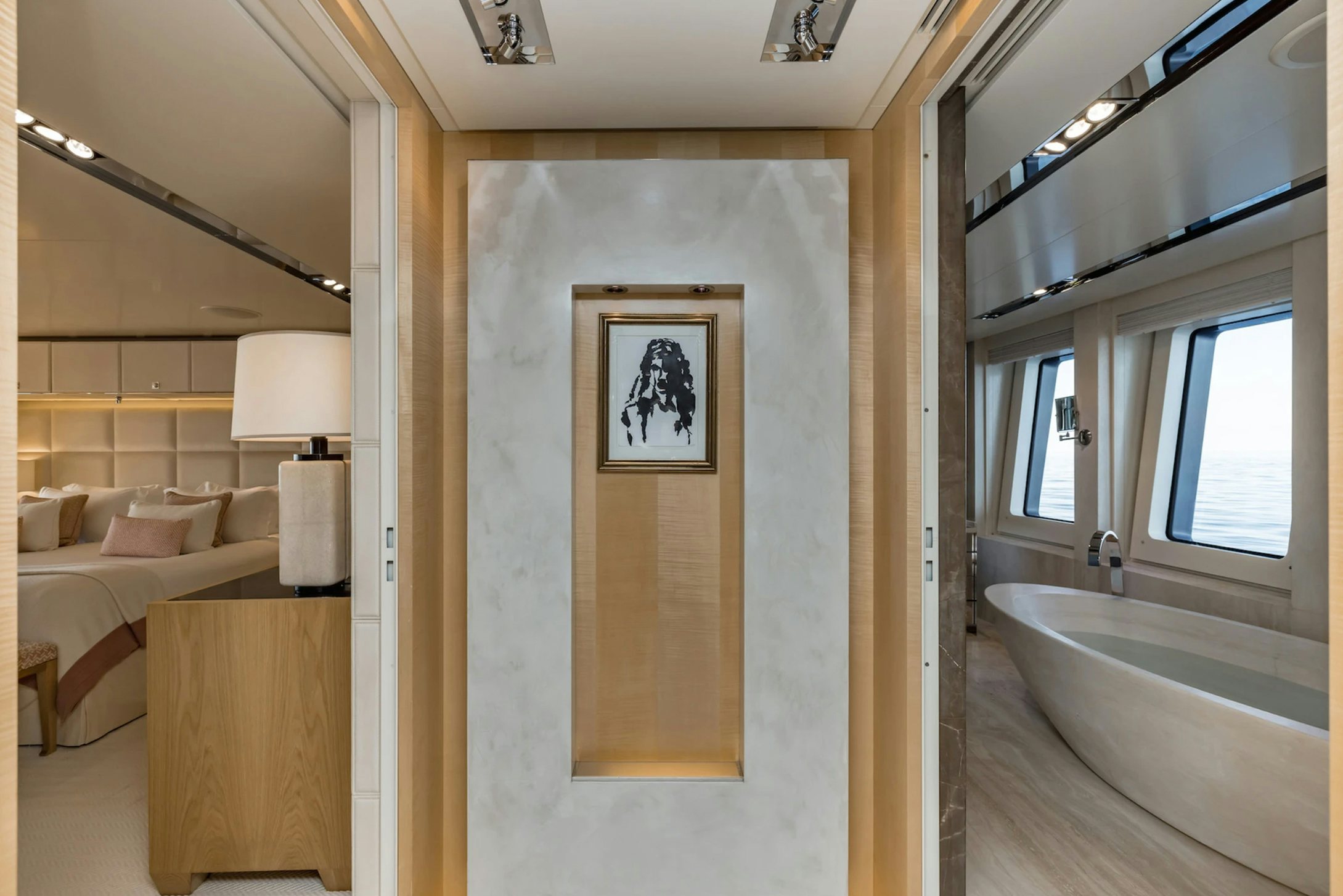 a large bathroom with a painting on the wall aboard LOON Yacht for Charter