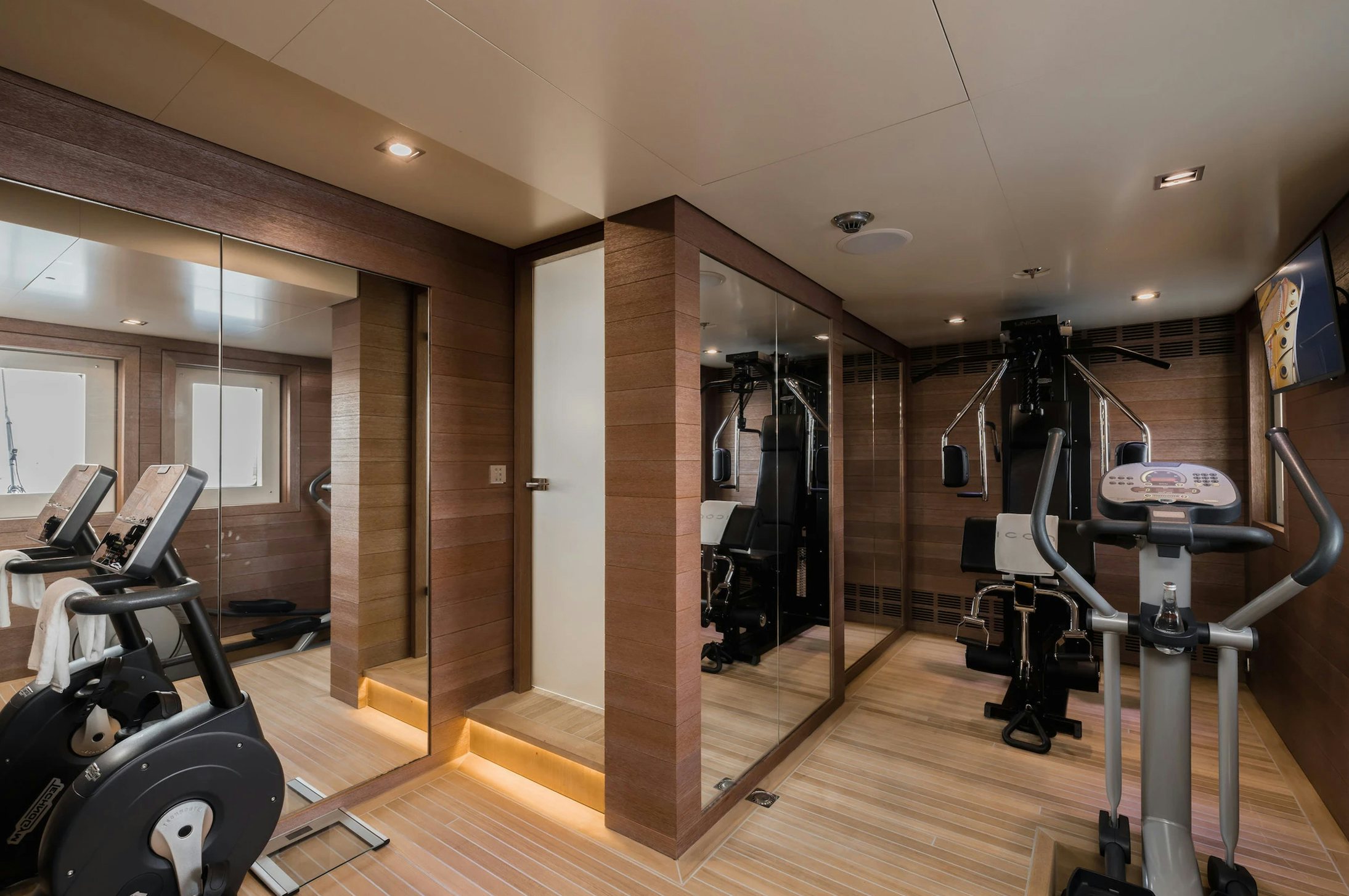 a room with exercise equipment aboard LOON Yacht for Charter