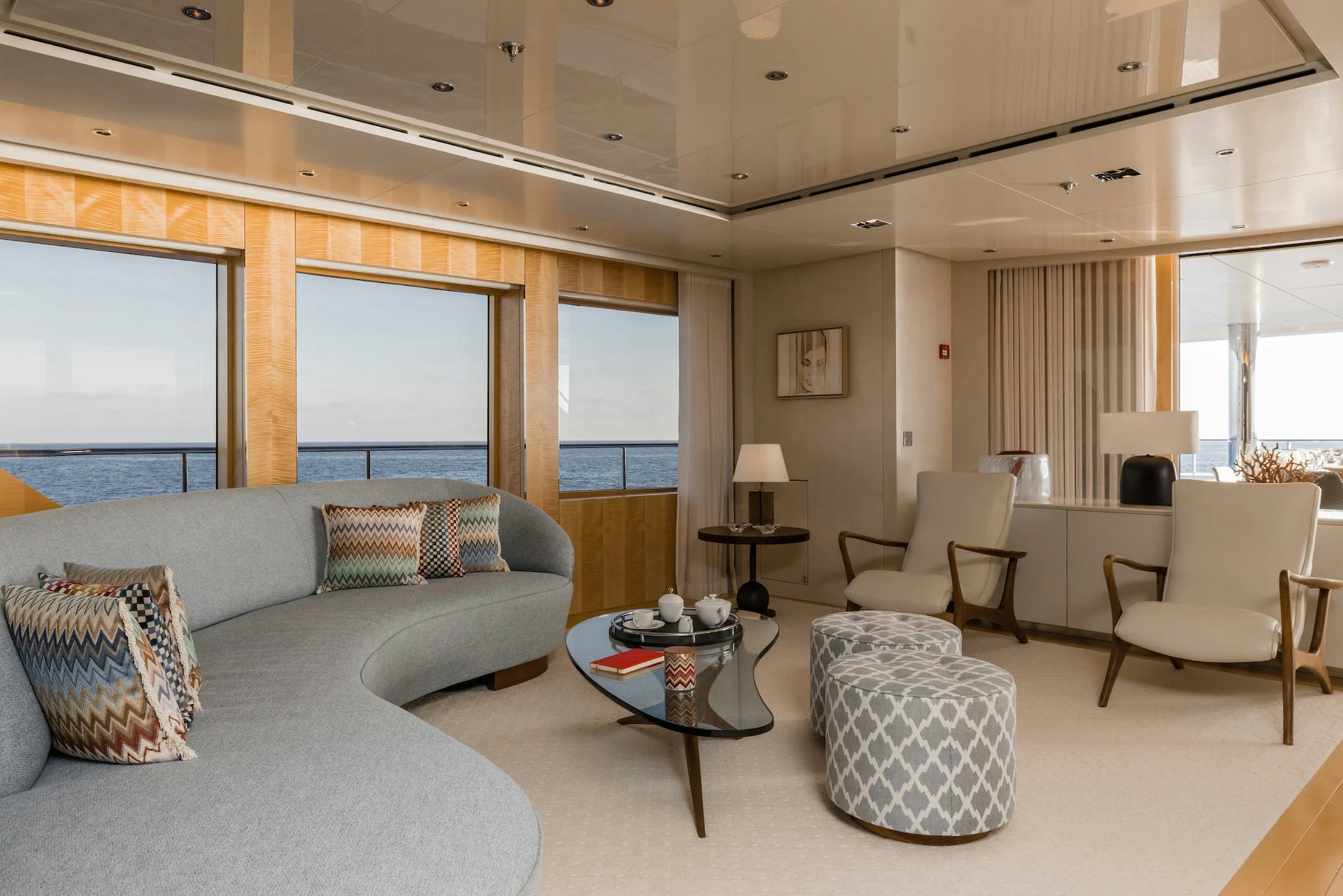 a living room with a couch and a coffee table aboard LOON Yacht for Charter