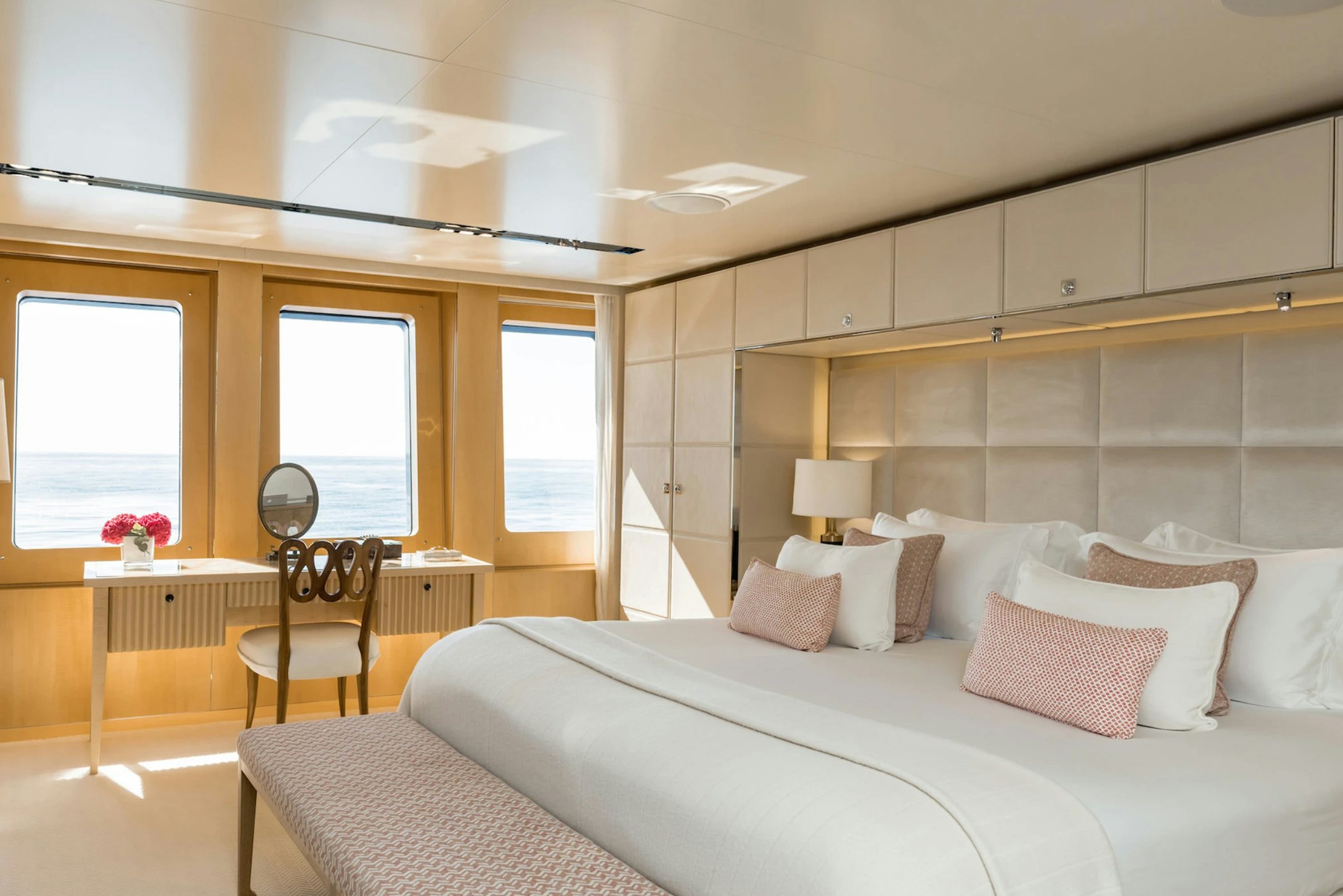 a bedroom with a large bed aboard LOON Yacht for Charter