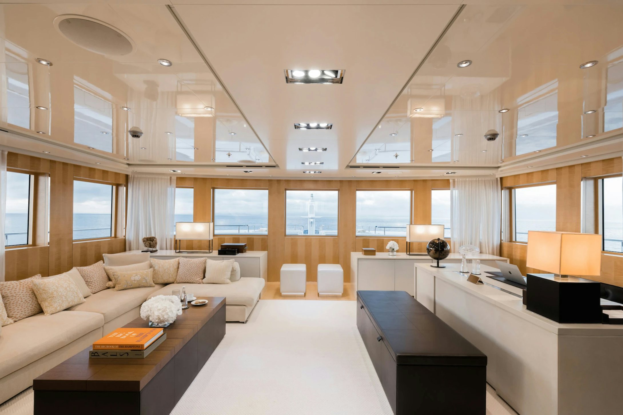 a living room with a couch and a table aboard LOON Yacht for Charter