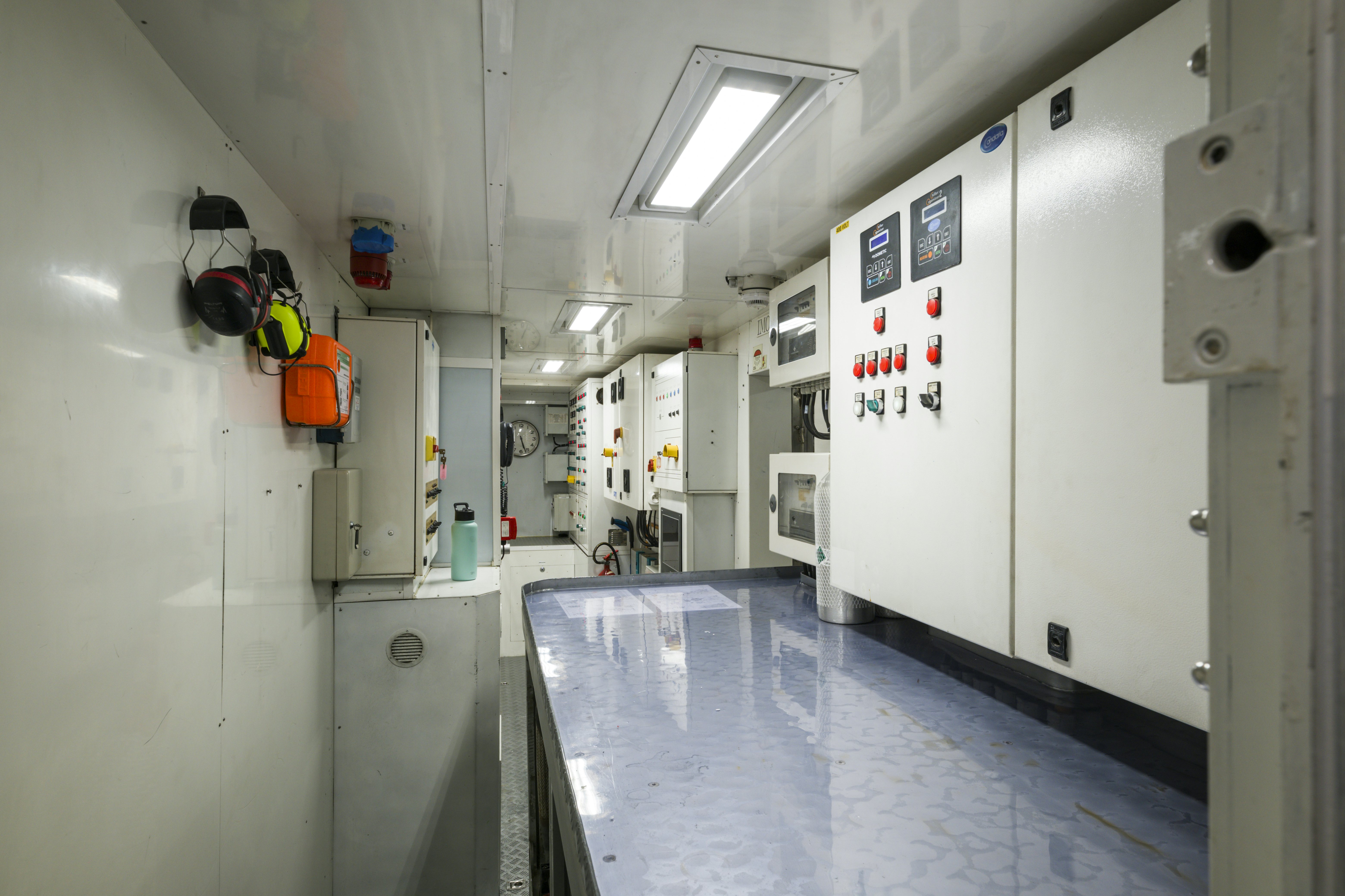 a long hallway with white walls aboard BALISTA Yacht for Sale