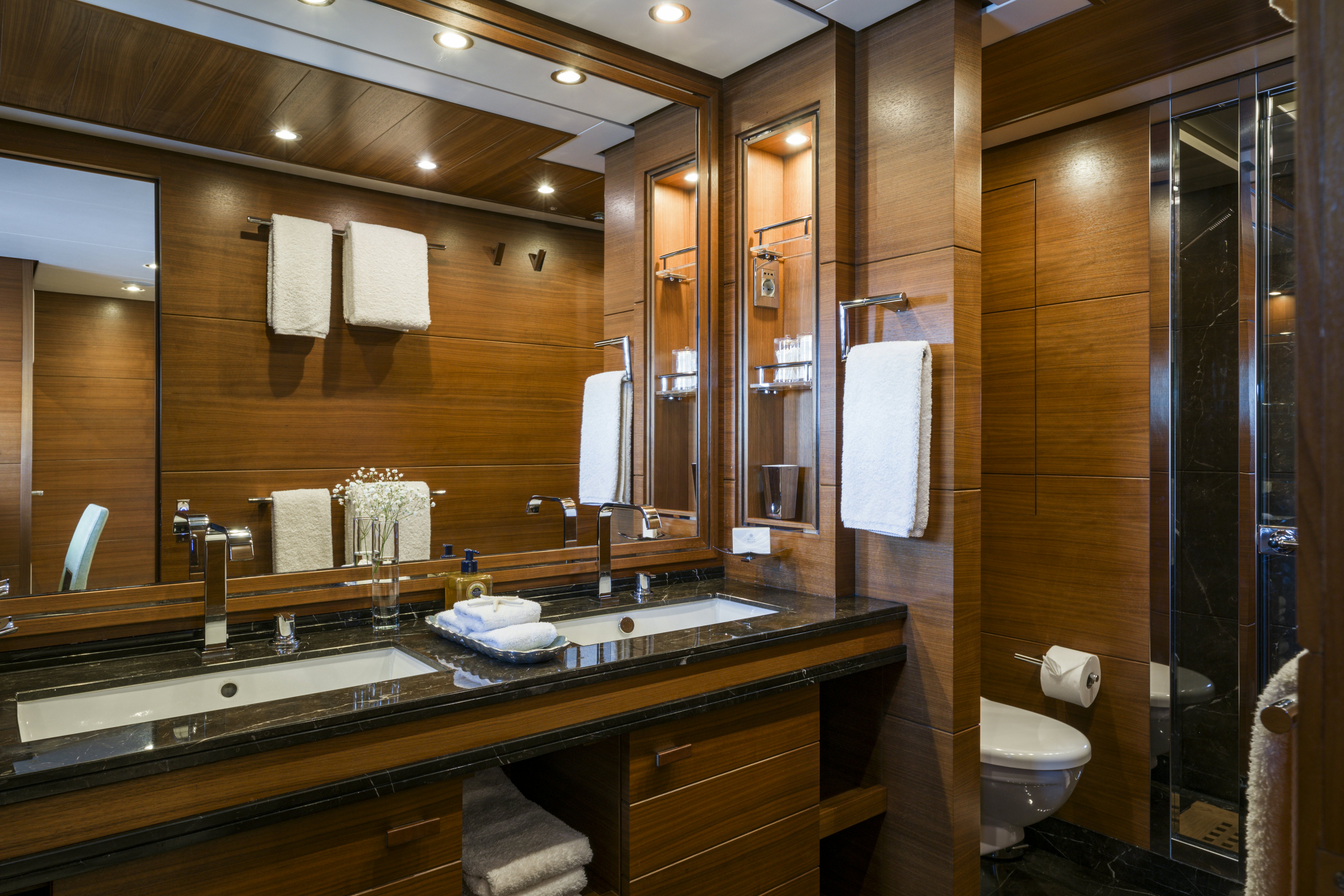 a bathroom with a large mirror aboard BALISTA Yacht for Sale
