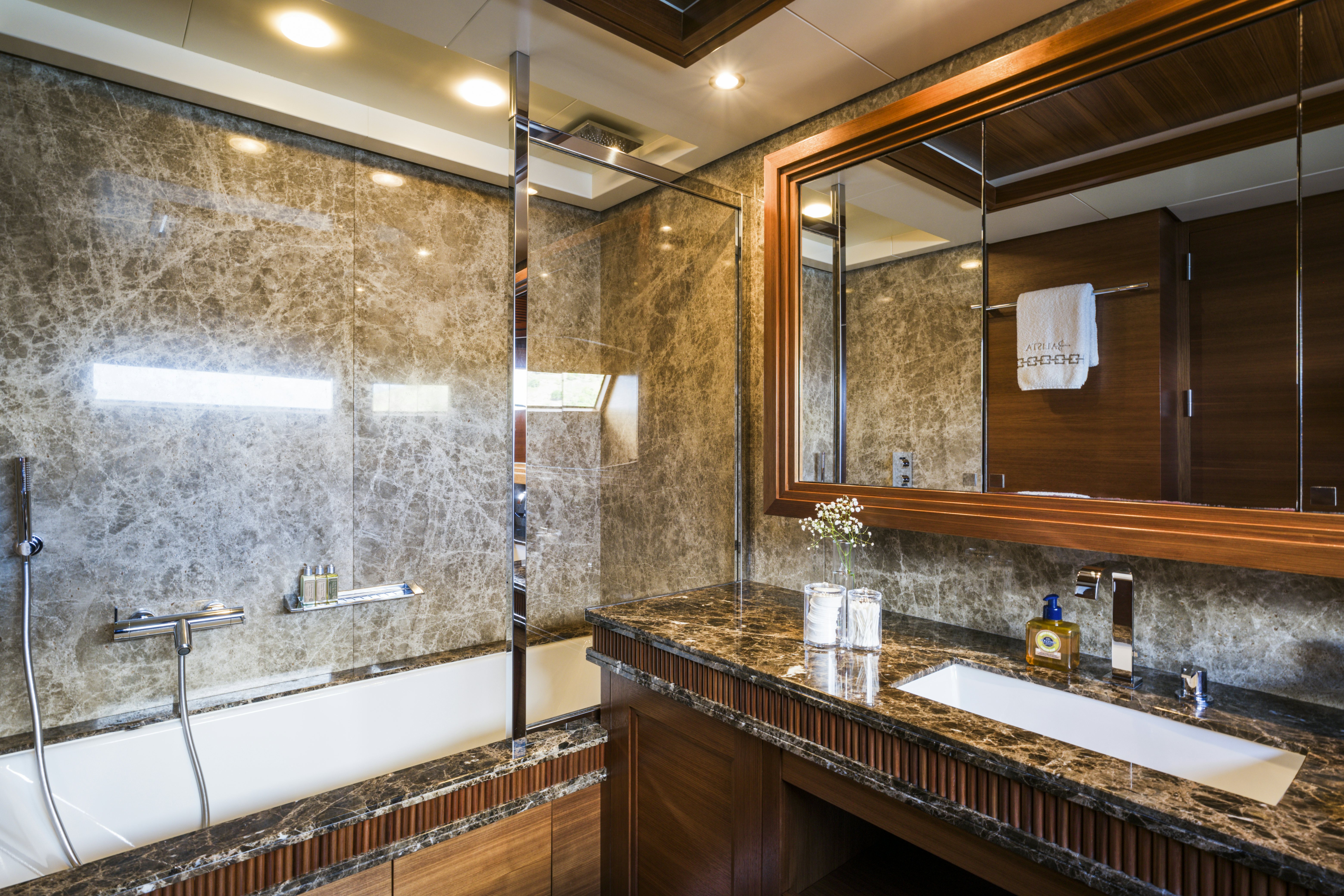 a bathroom with a large mirror aboard BALISTA Yacht for Sale