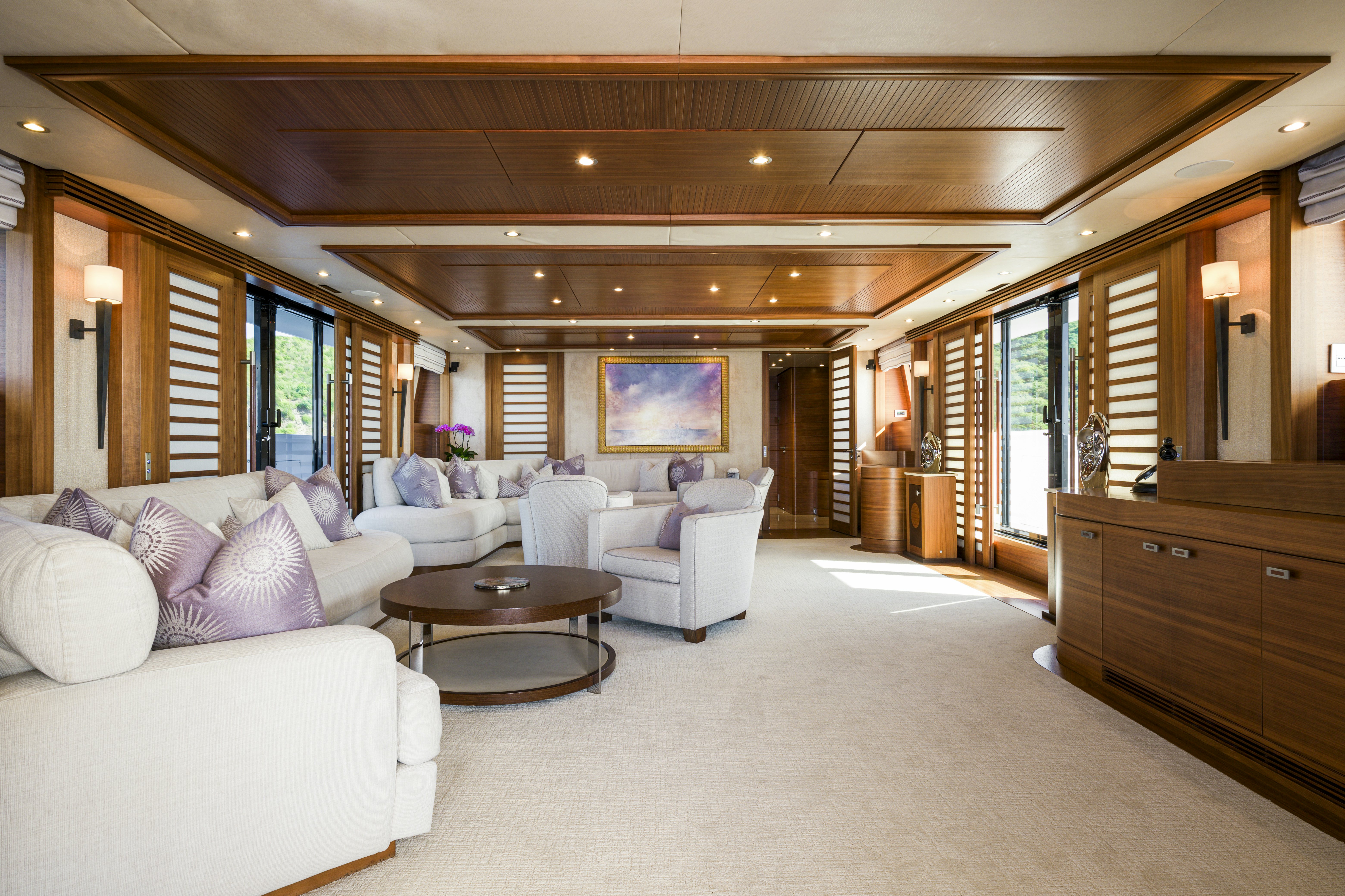 a large living room with a large open door aboard BALISTA Yacht for Sale