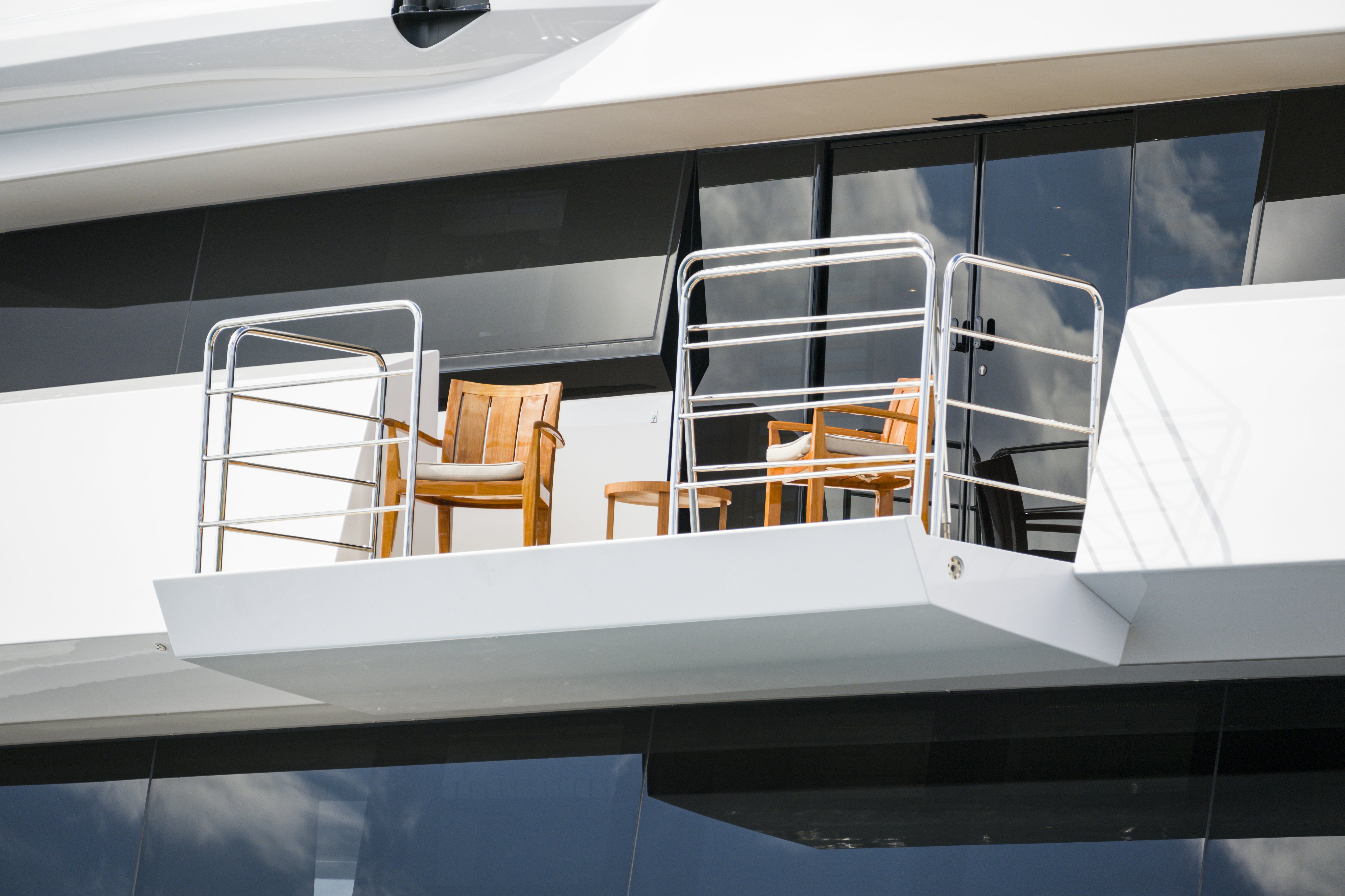 a white table with chairs on it aboard BALISTA Yacht for Sale