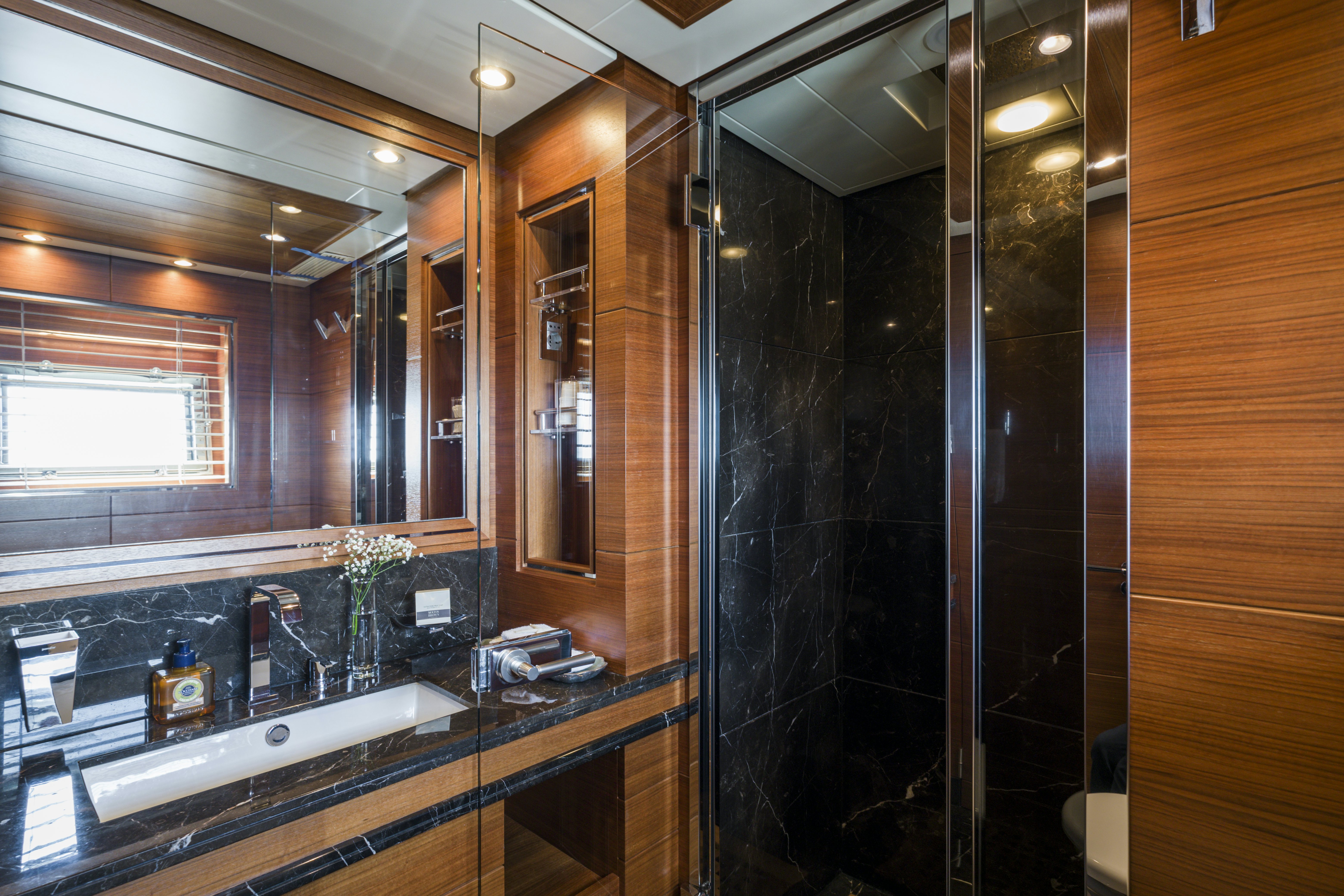 a bathroom with a large mirror aboard BALISTA Yacht for Sale
