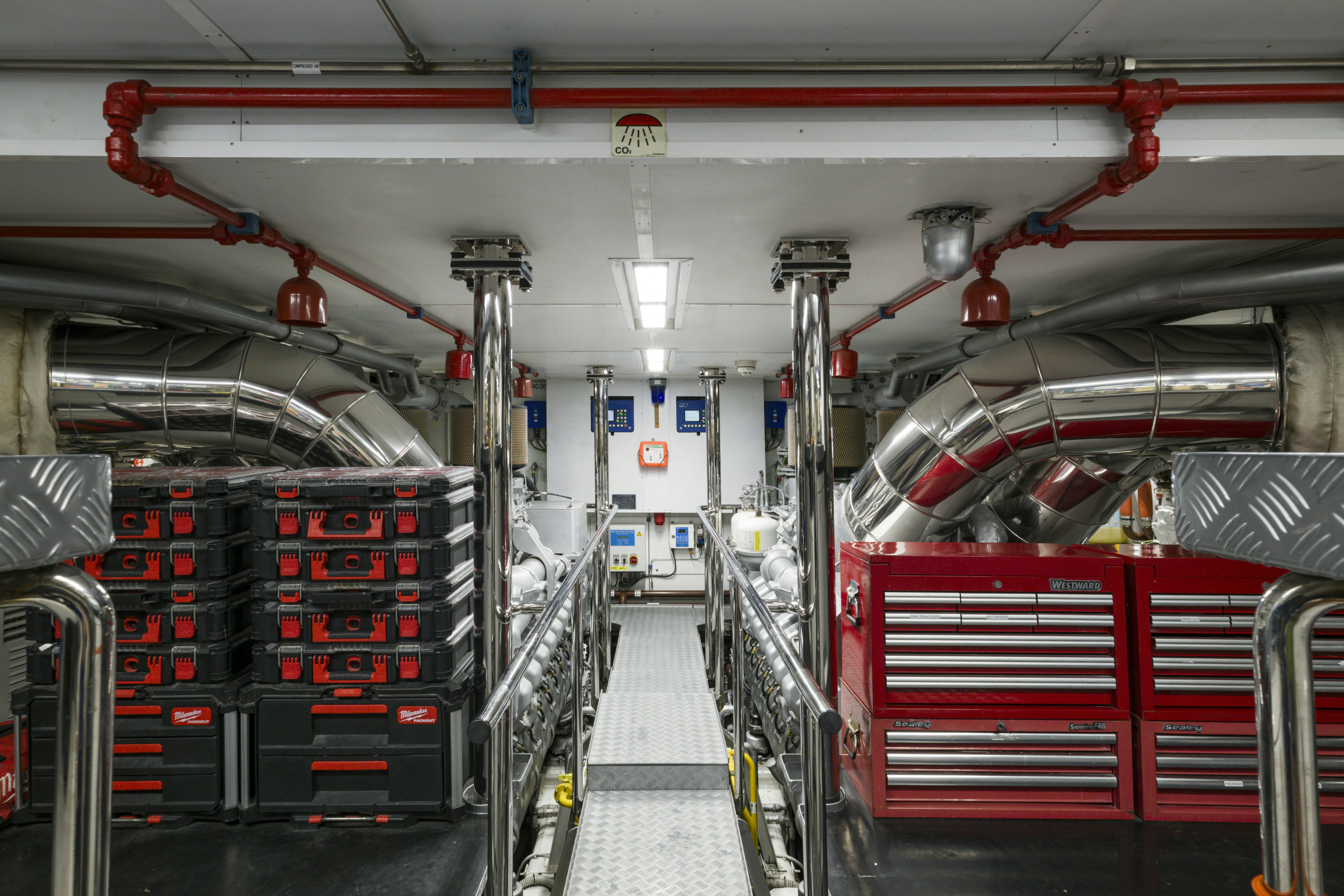 a large room with red machinery aboard BALISTA Yacht for Sale