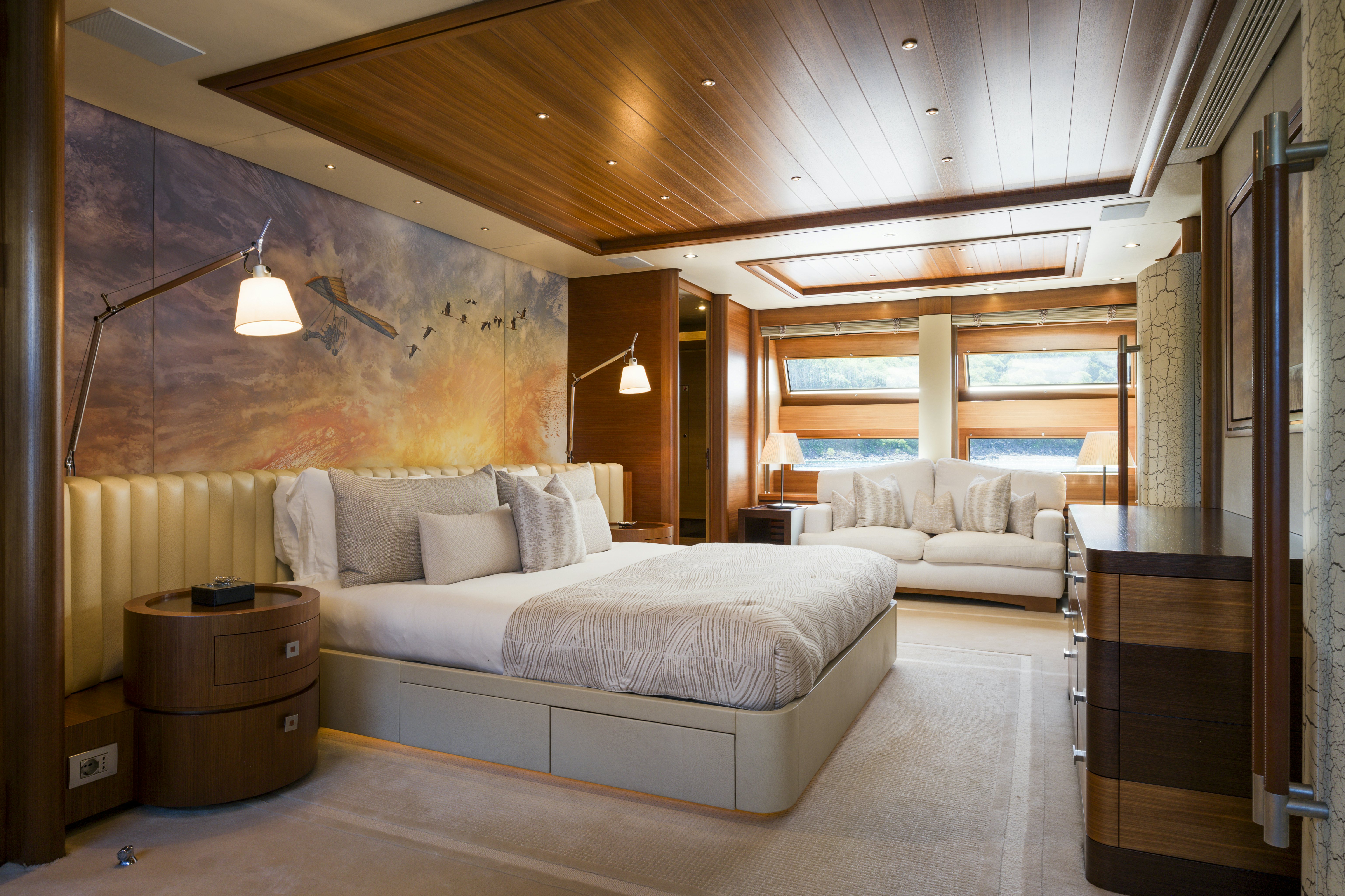 a large room with a bed and a couch aboard BALISTA Yacht for Sale