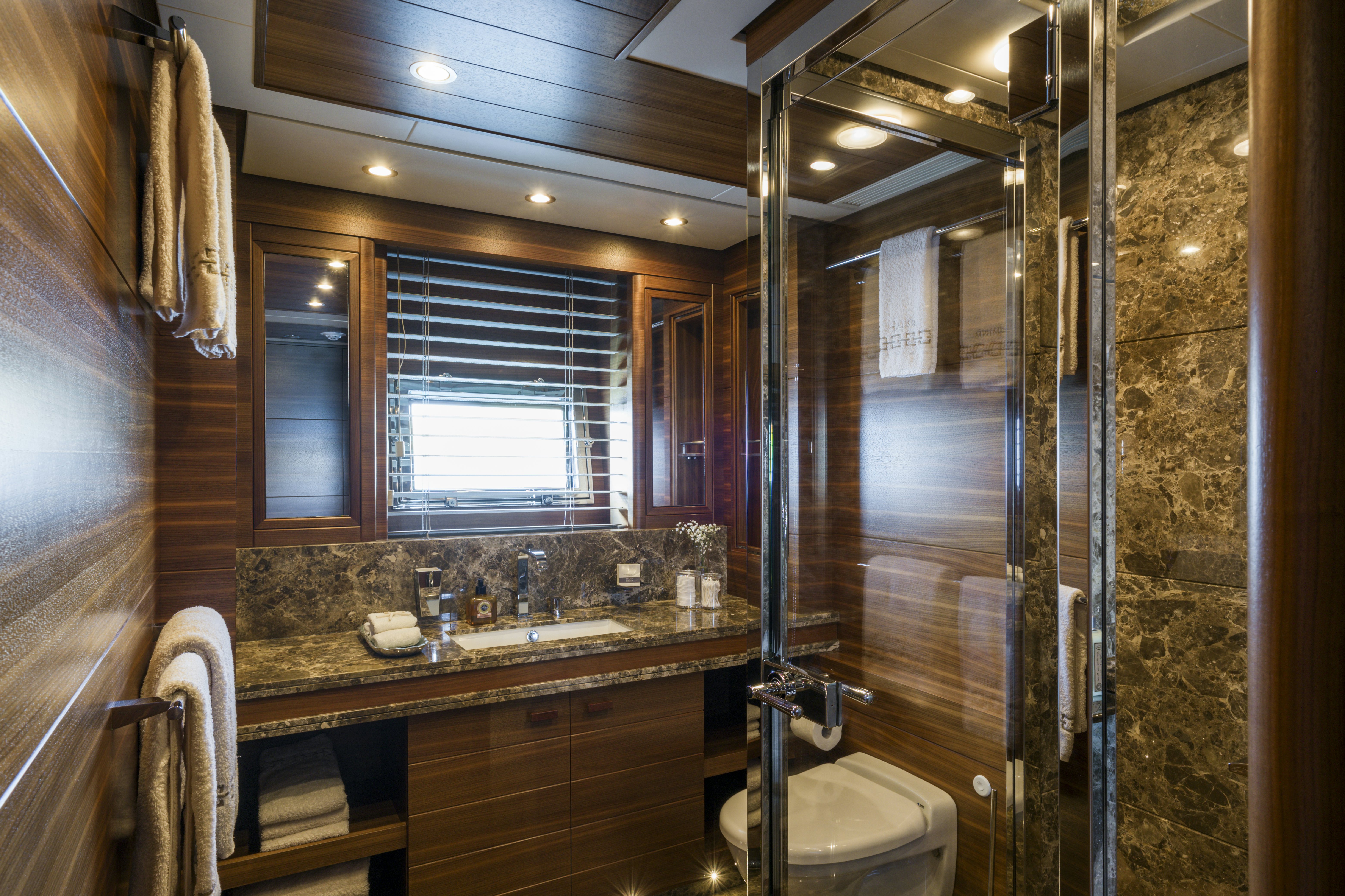 a bathroom with a large mirror aboard BALISTA Yacht for Sale