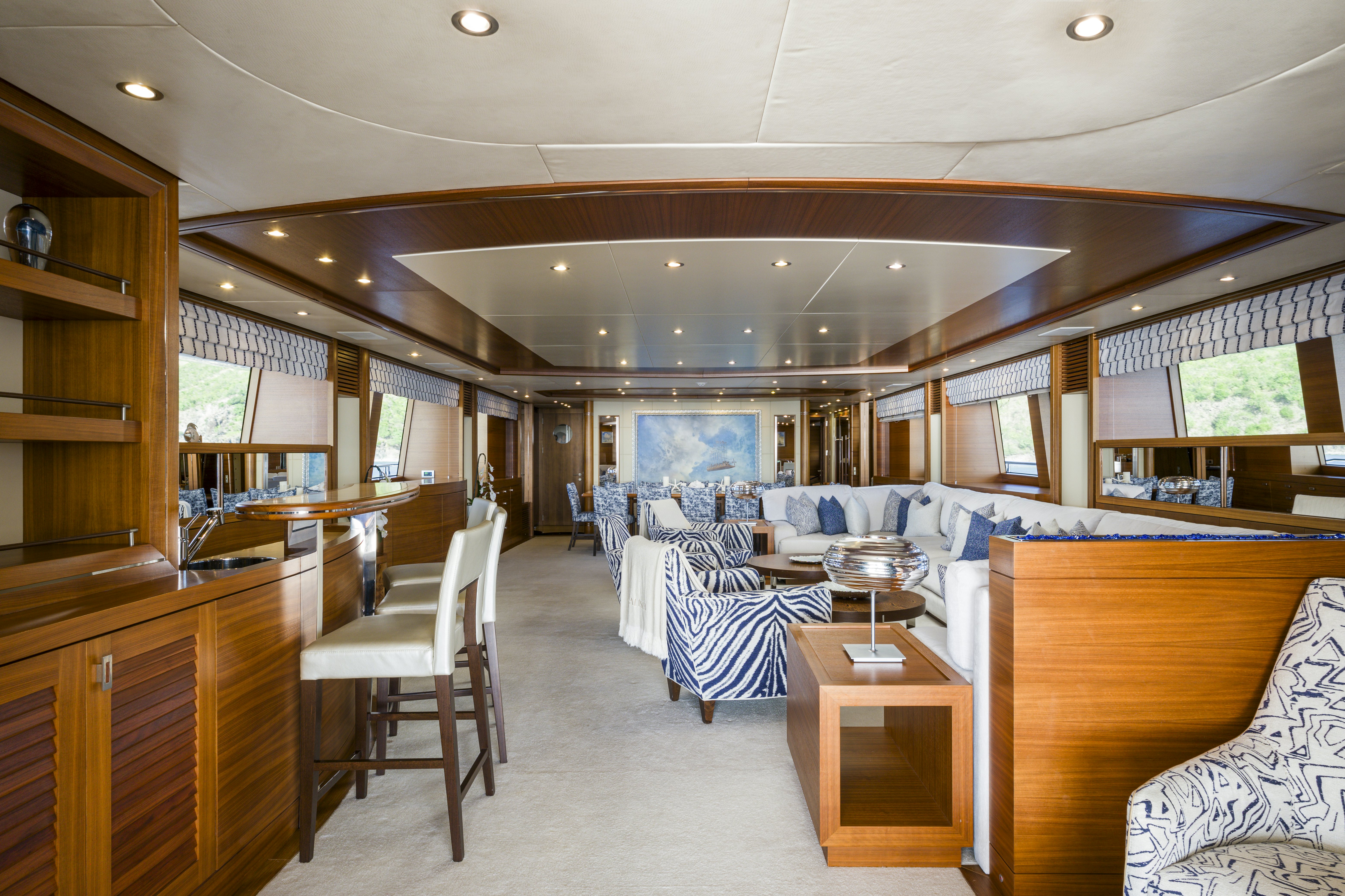 a room with a table chairs and a large window aboard BALISTA Yacht for Sale