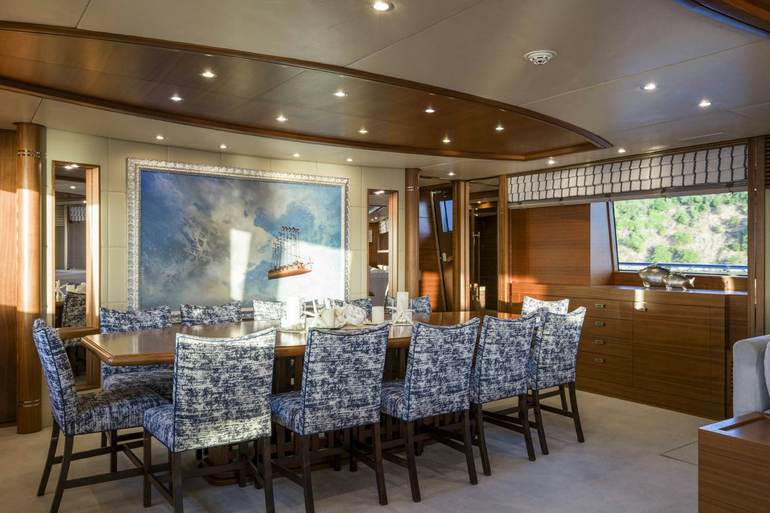 a large room with a table and chairs aboard BALISTA Yacht for Charter
