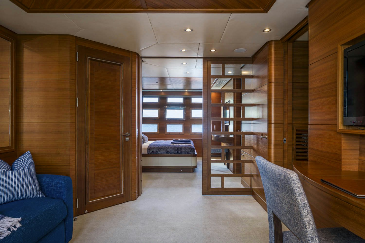 a room with a bed and a couch aboard BALISTA Yacht for Charter