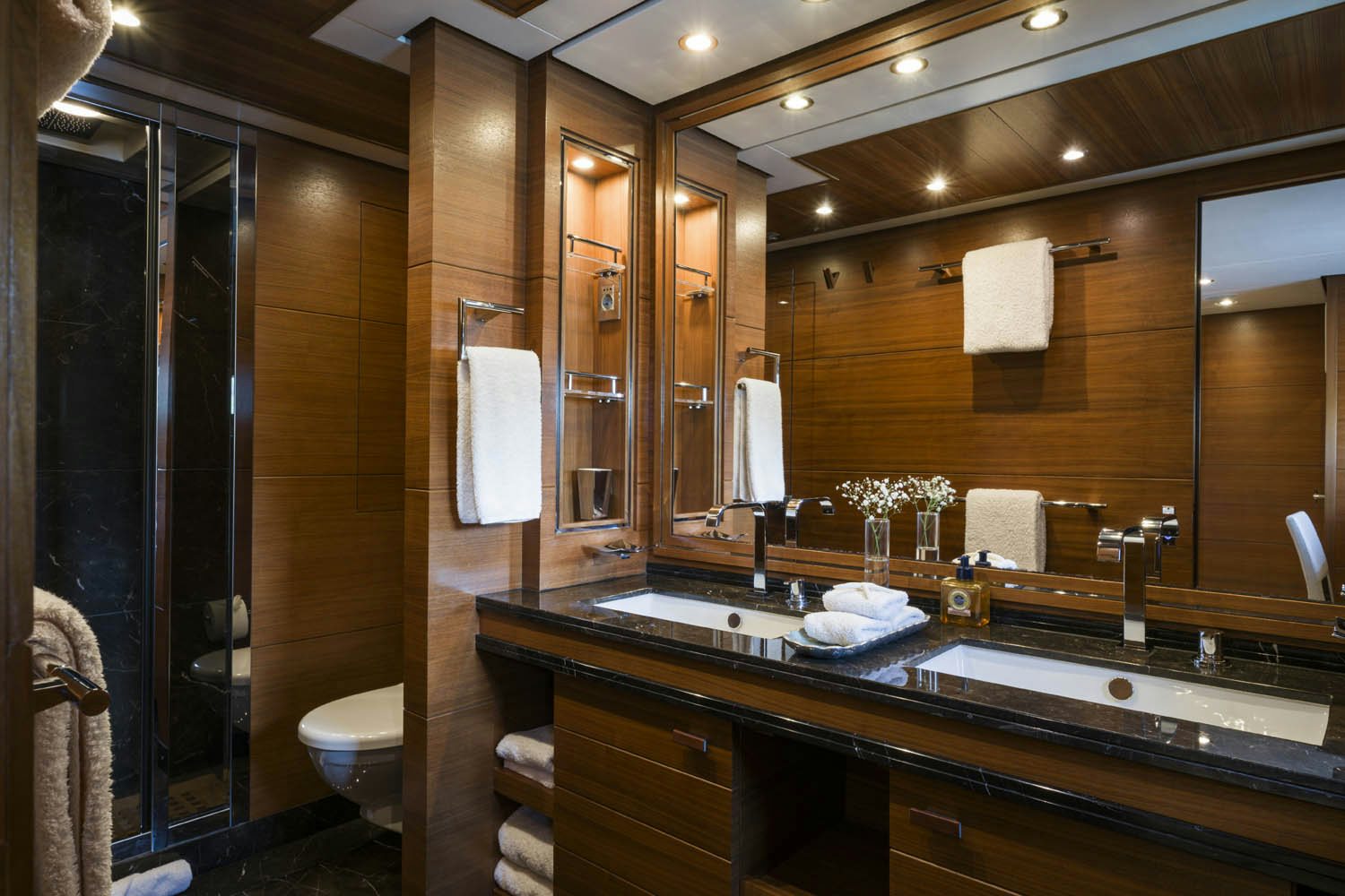 a bathroom with a large mirror aboard BALISTA Yacht for Charter