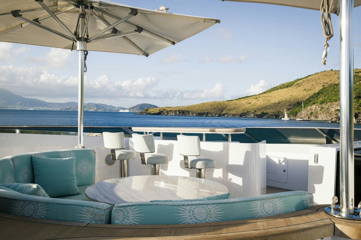 a lounge area with a large umbrella aboard BALISTA Yacht for Charter