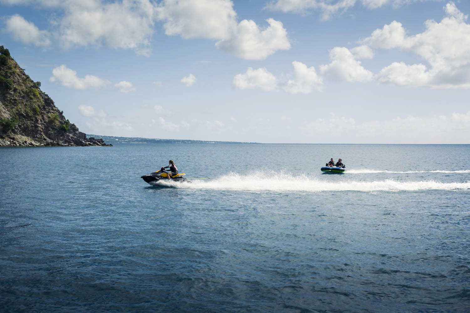 a couple of people in a boat on the water aboard BALISTA Yacht for Charter