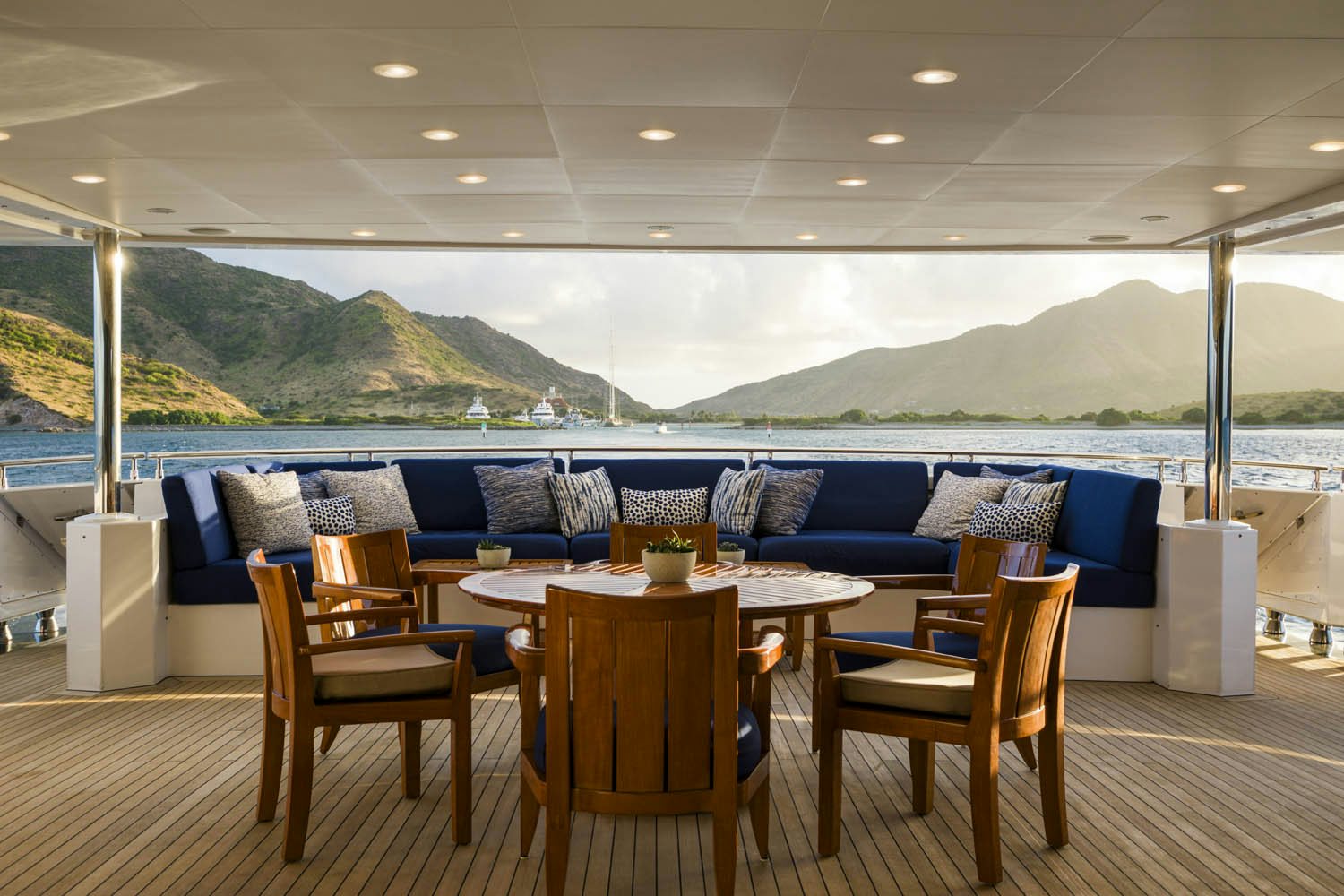 a table and chairs on a deck aboard BALISTA Yacht for Charter