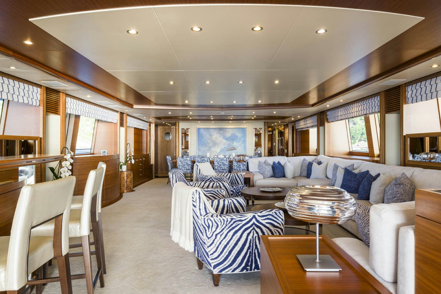 a living room with a large window aboard BALISTA Yacht for Charter