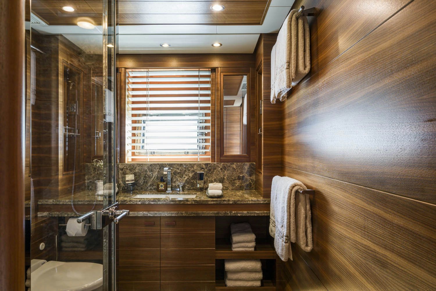 a bathroom with wooden cabinets aboard BALISTA Yacht for Charter