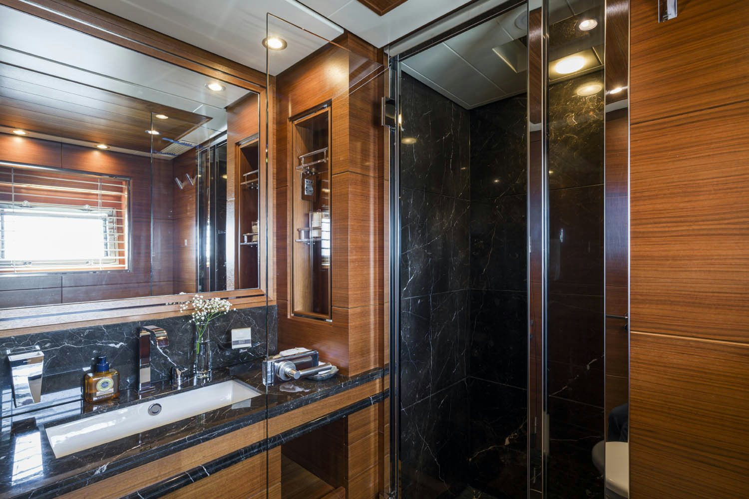 a bathroom with a large mirror aboard BALISTA Yacht for Charter