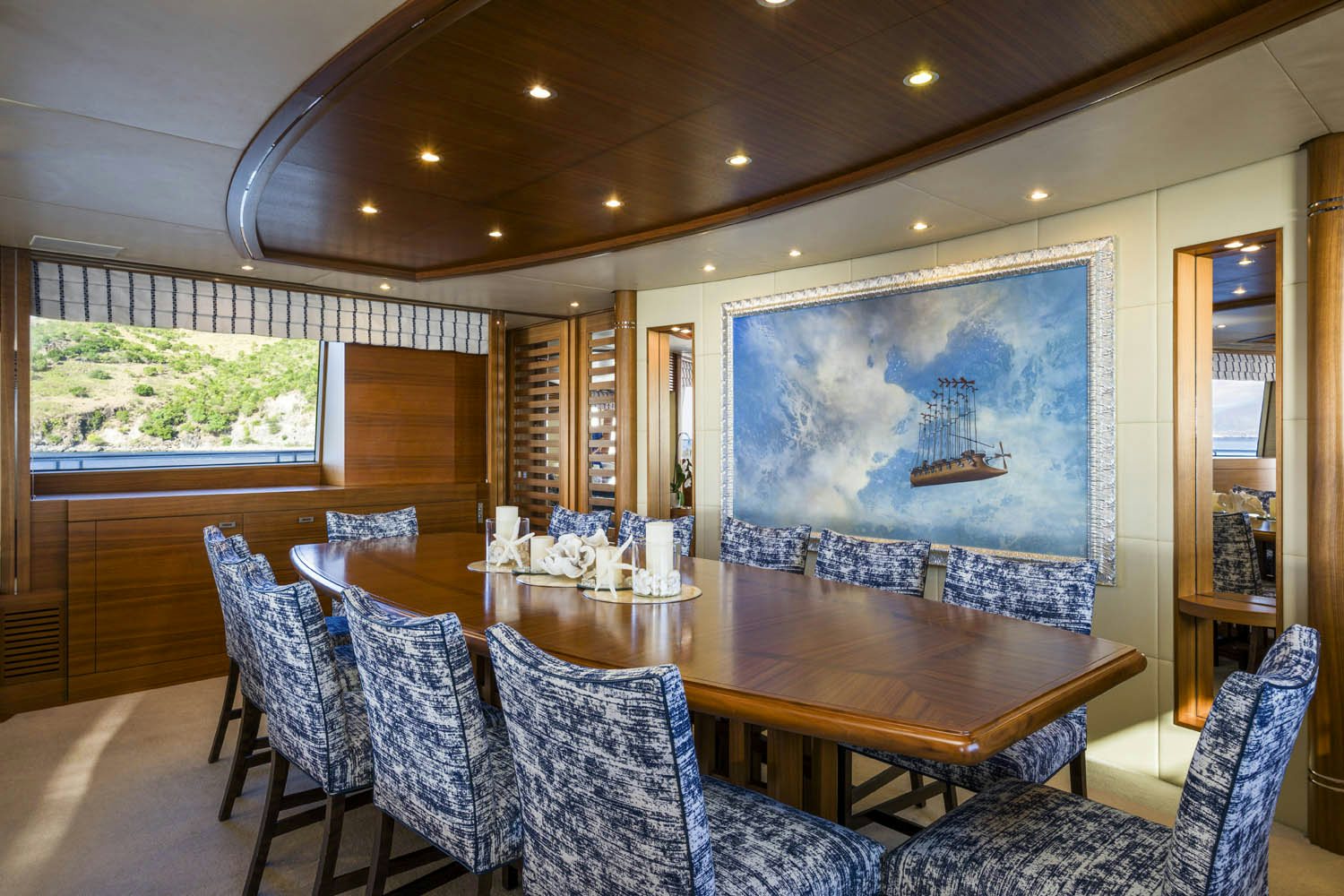 a large room with a table and chairs aboard BALISTA Yacht for Charter