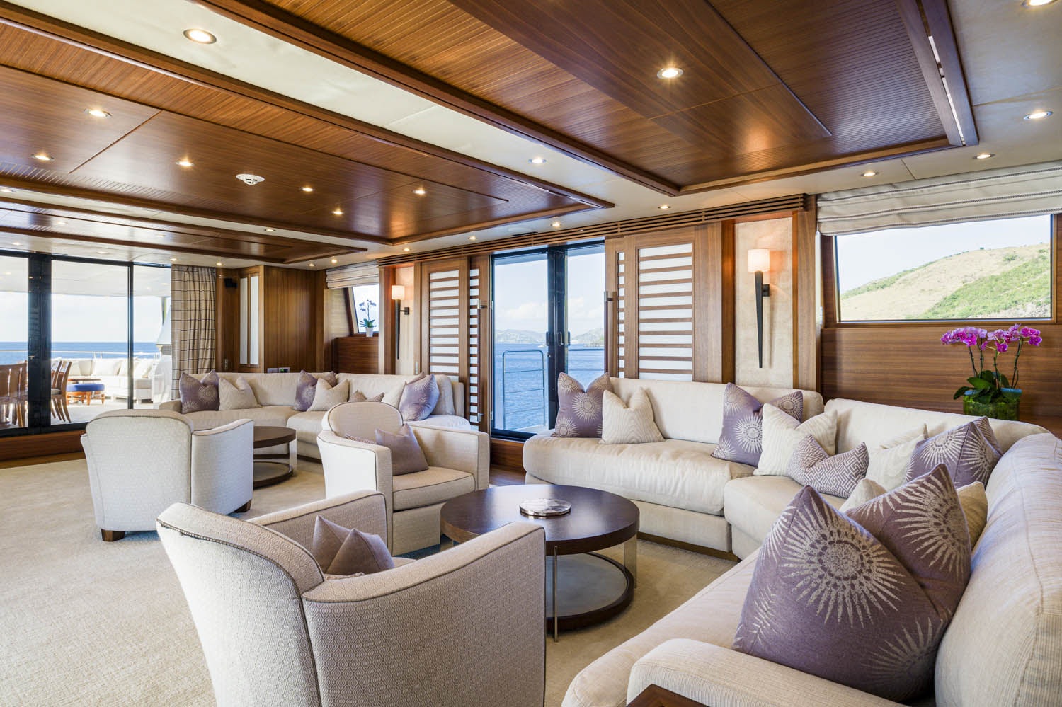 a living room with a large window aboard BALISTA Yacht for Charter