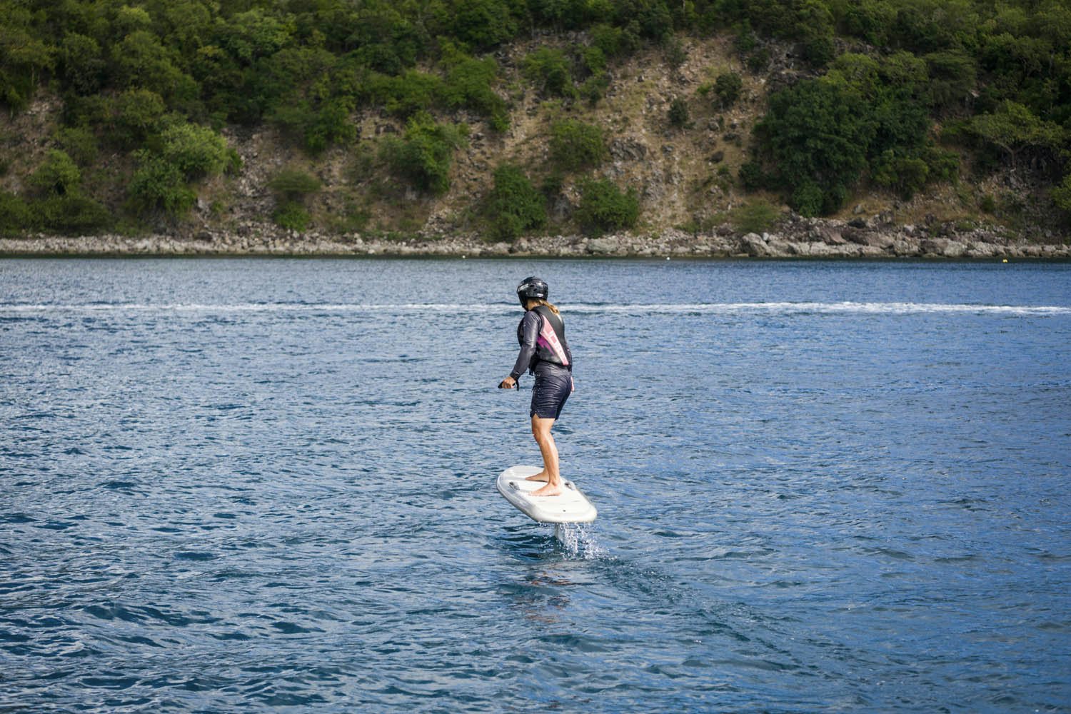 a man surfing on the water aboard BALISTA Yacht for Charter