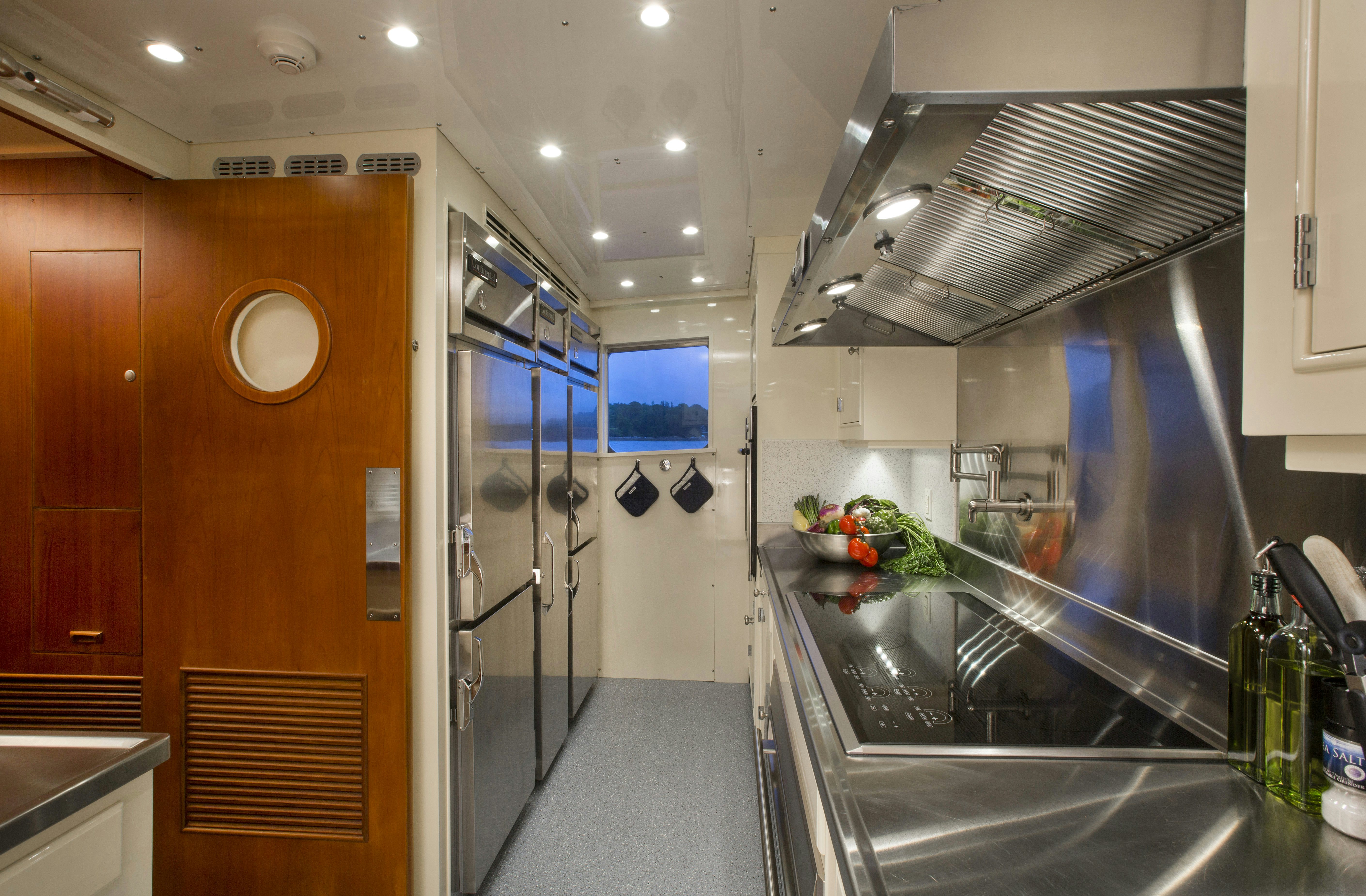a kitchen with glass doors aboard STONEFACE Yacht for Sale