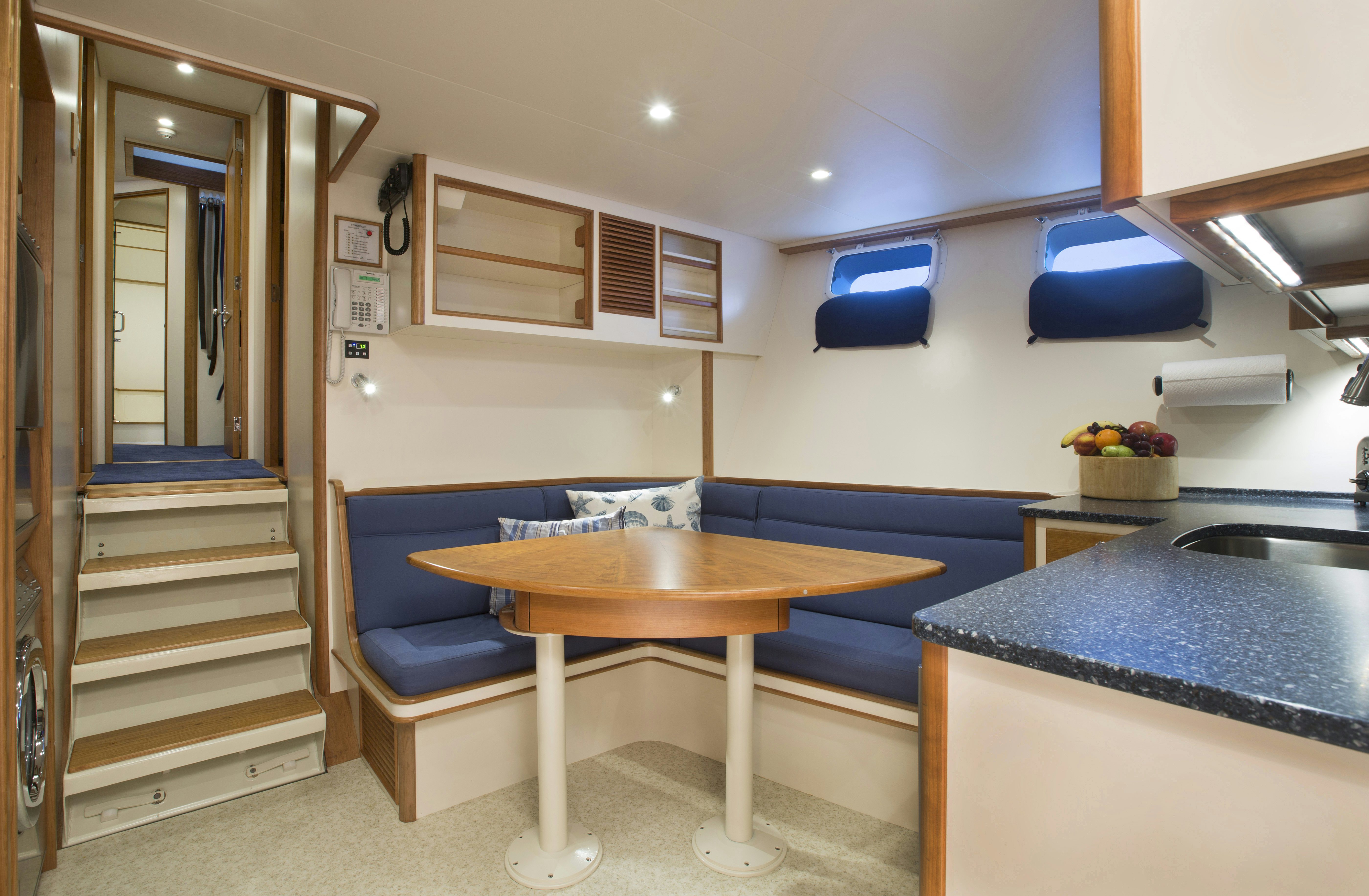 a room with a desk and a bed aboard STONEFACE Yacht for Sale