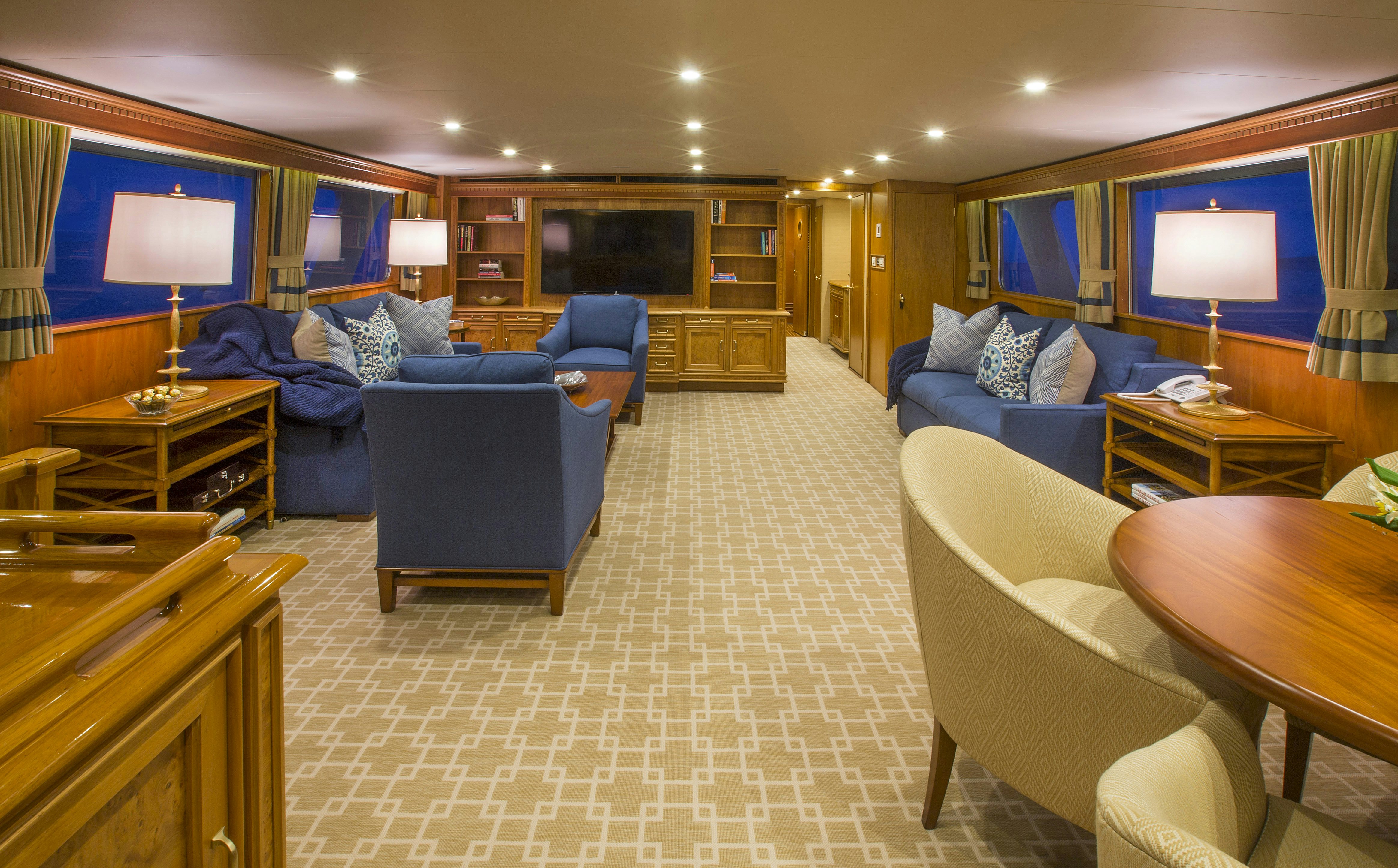 a room with a couch and a television aboard STONEFACE Yacht for Sale