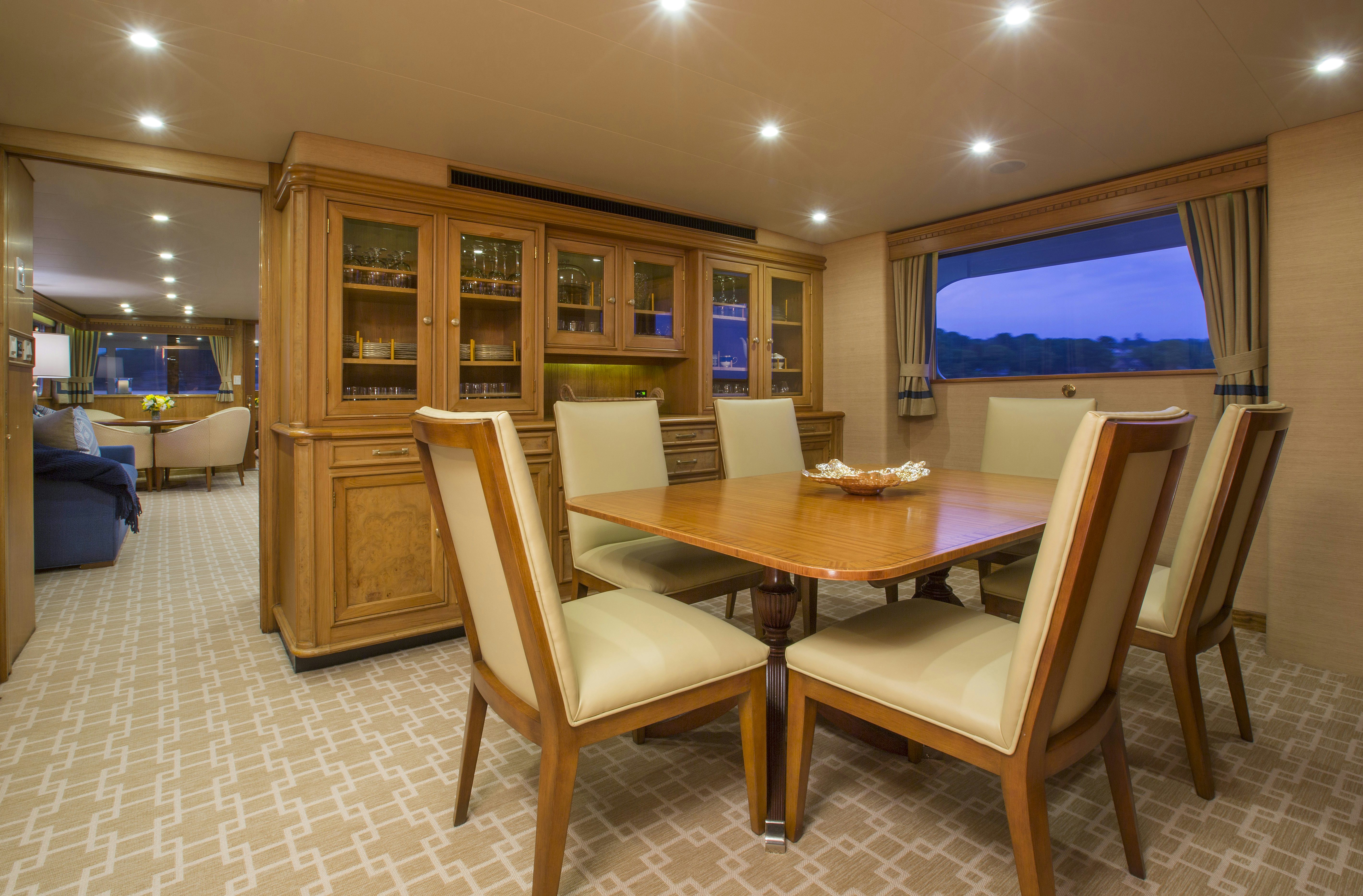 a conference room with a table and chairs aboard STONEFACE Yacht for Sale