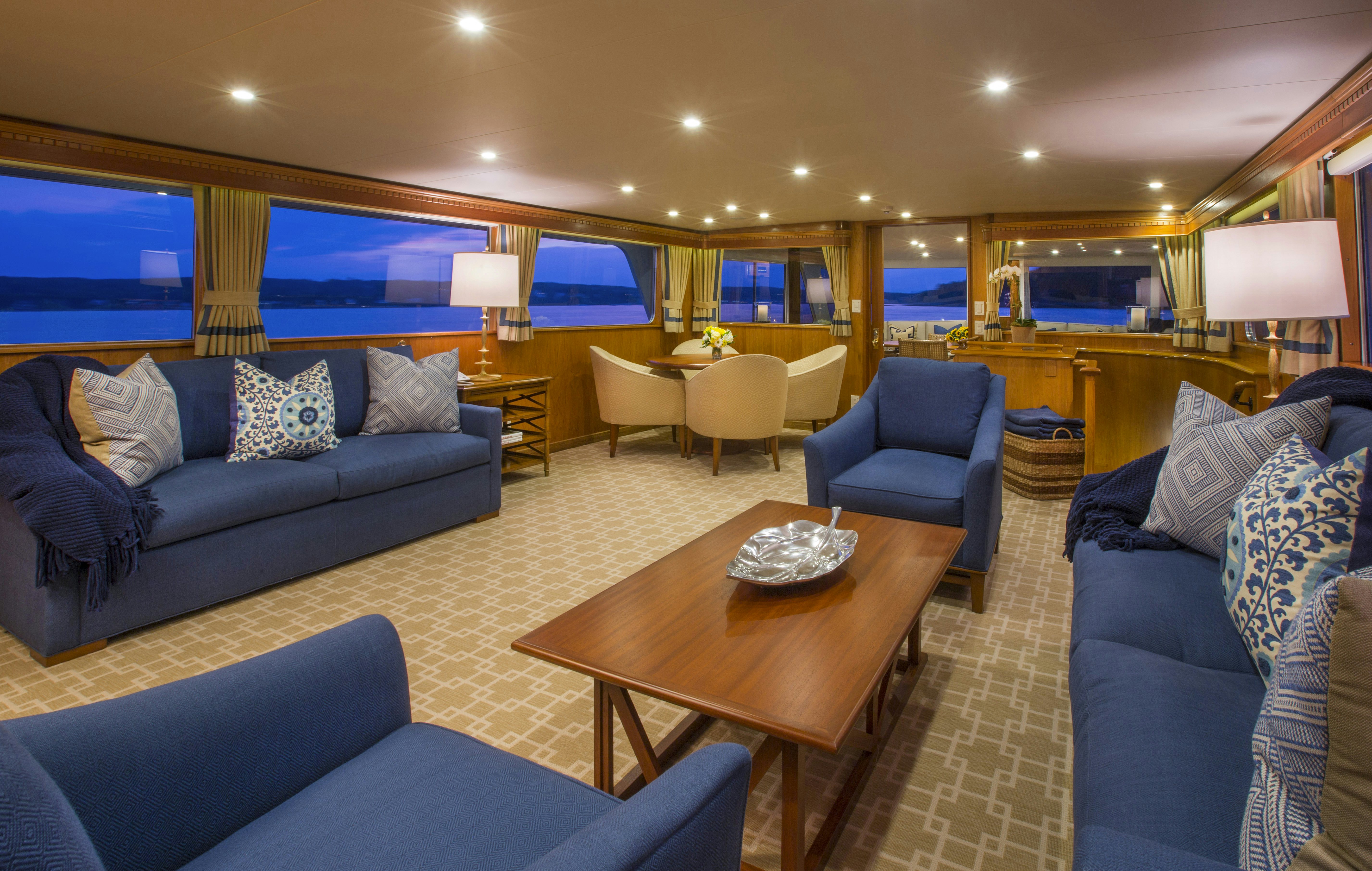 a living room with a large screen aboard STONEFACE Yacht for Sale