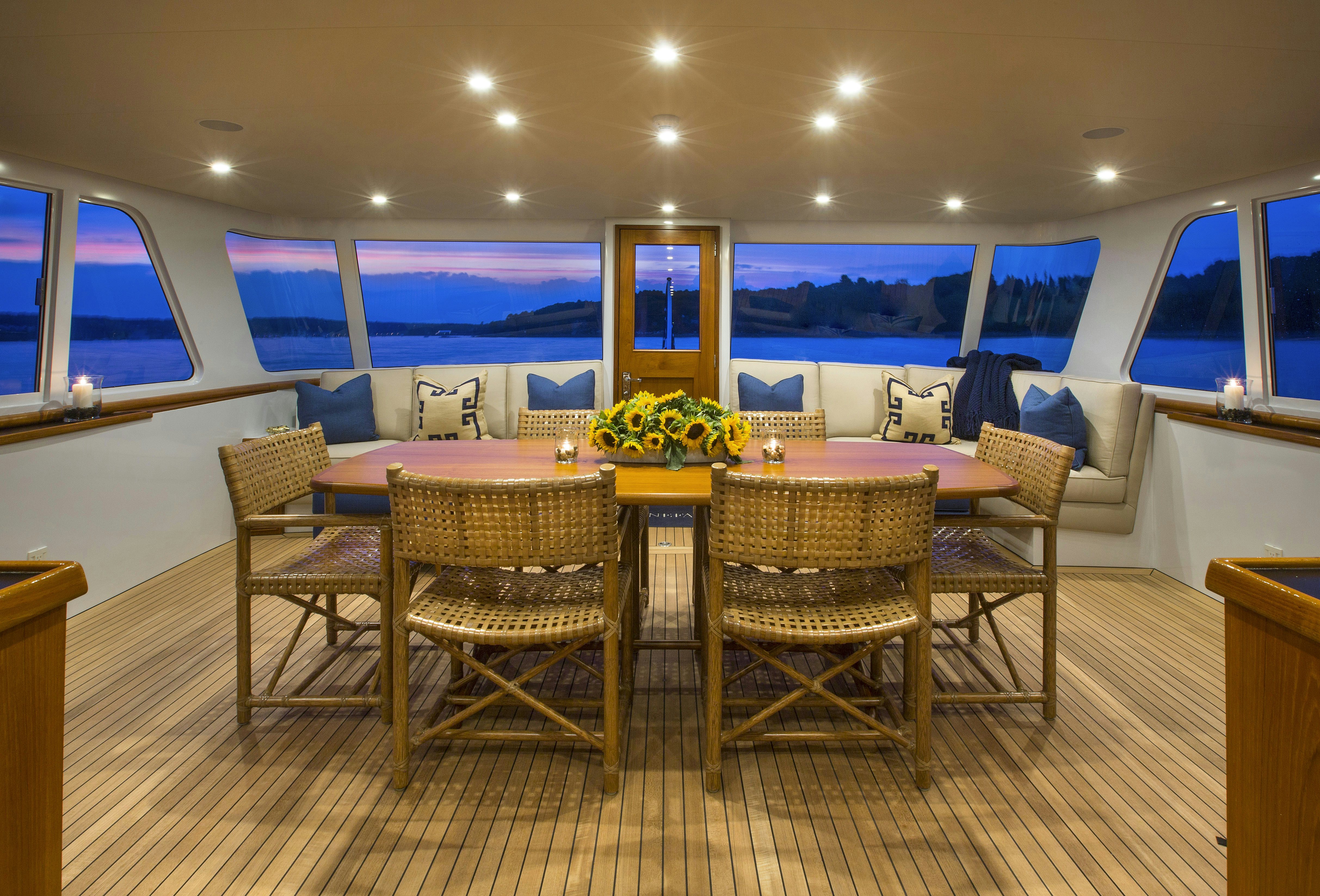 a table and chairs in a room aboard STONEFACE Yacht for Sale