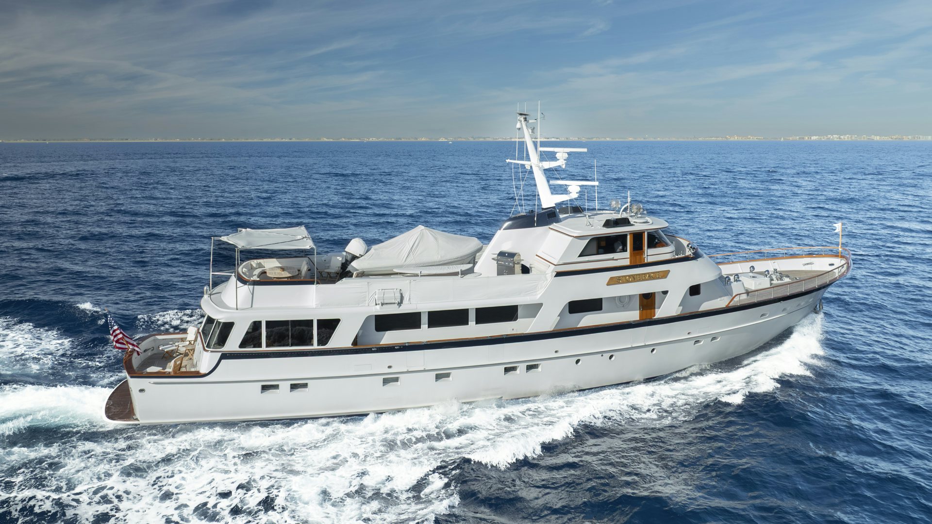 a white yacht in the water aboard STONEFACE Yacht for Sale