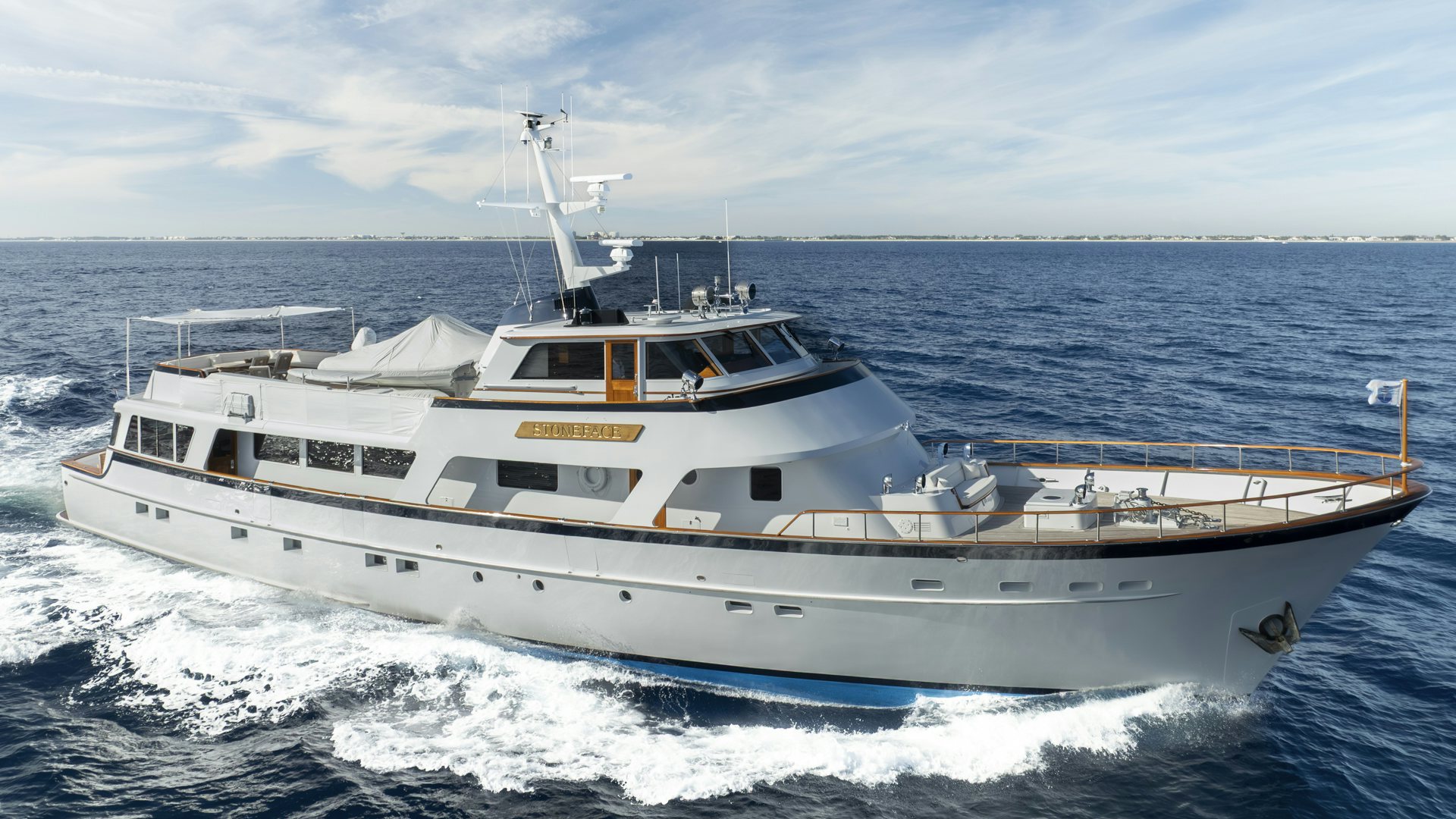 a white boat on the water aboard STONEFACE Yacht for Sale