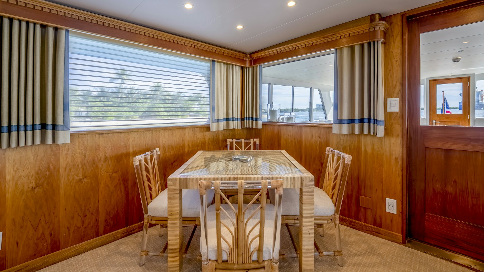 a dining table in a room aboard STONEFACE Yacht for Sale