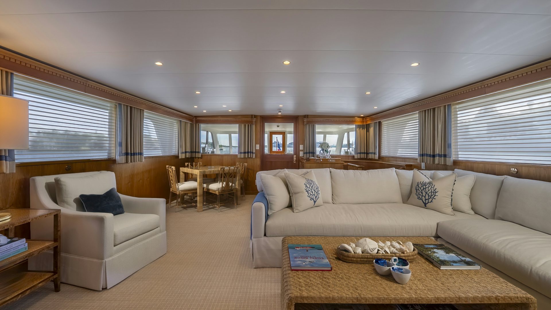 a living room with a couch and a table aboard STONEFACE Yacht for Sale