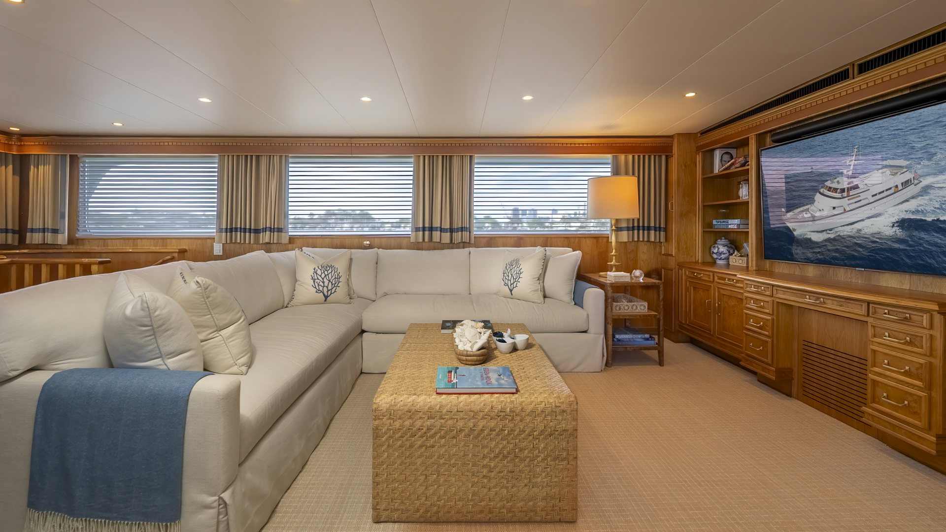 a living room with a large screen aboard STONEFACE Yacht for Sale