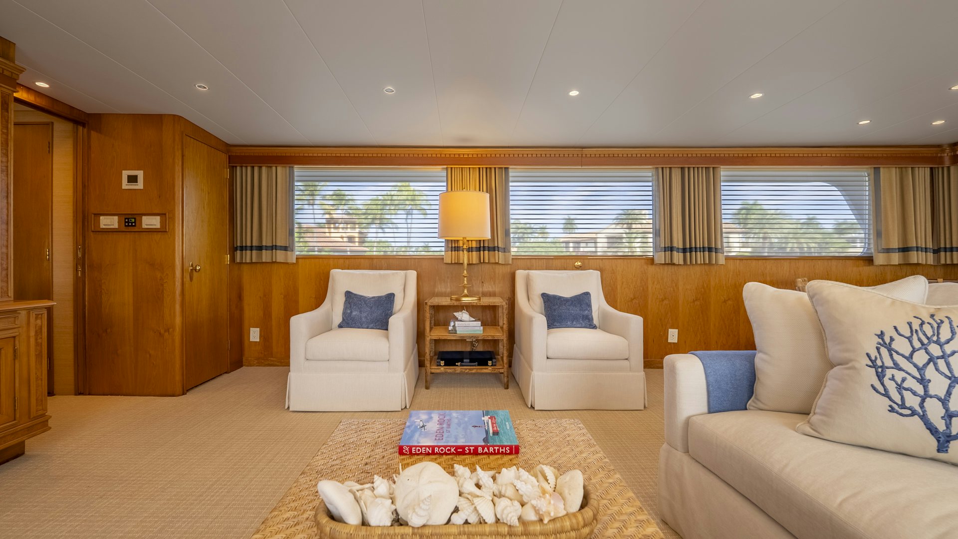 a living room with a couch and a table aboard STONEFACE Yacht for Sale