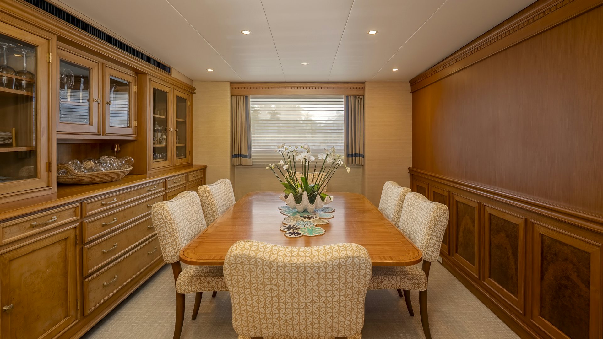 a kitchen with a dining table aboard STONEFACE Yacht for Sale
