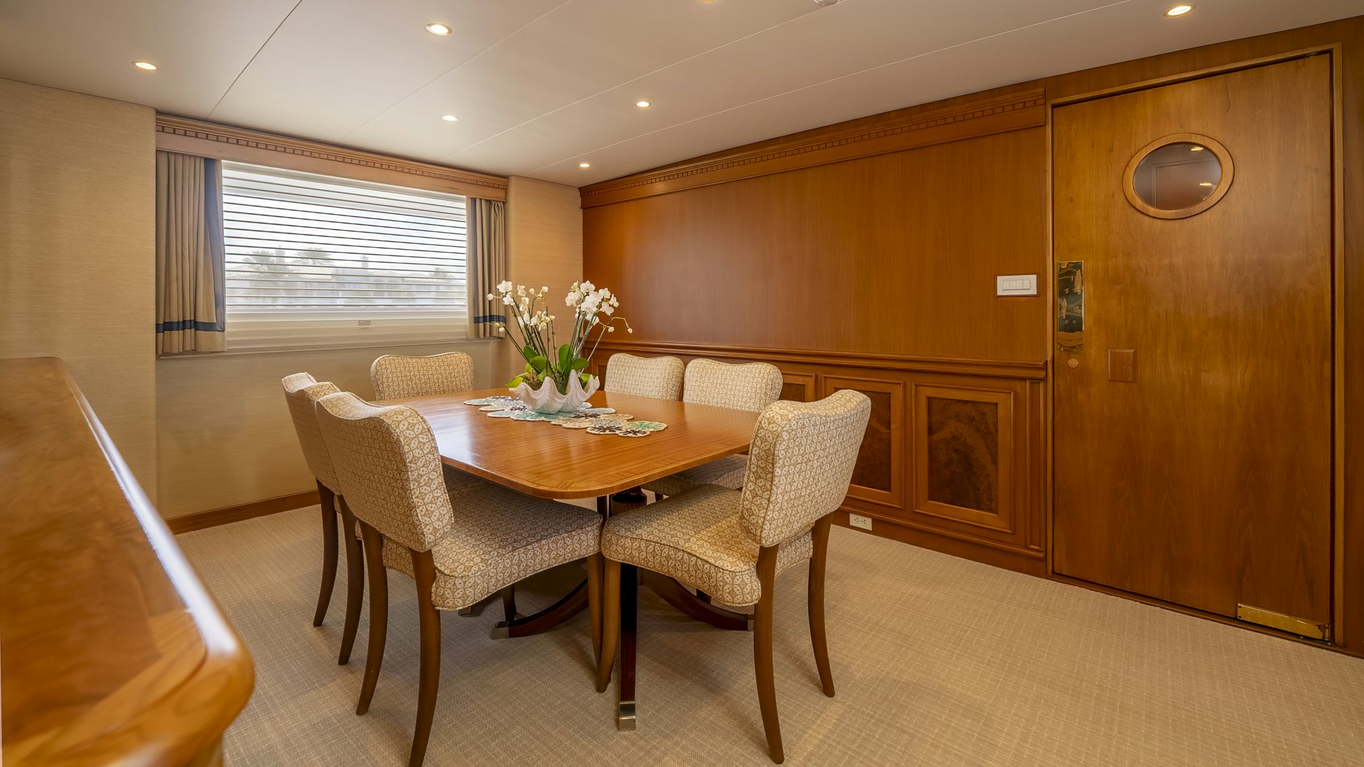 a dining room with chairs and a table aboard STONEFACE Yacht for Sale
