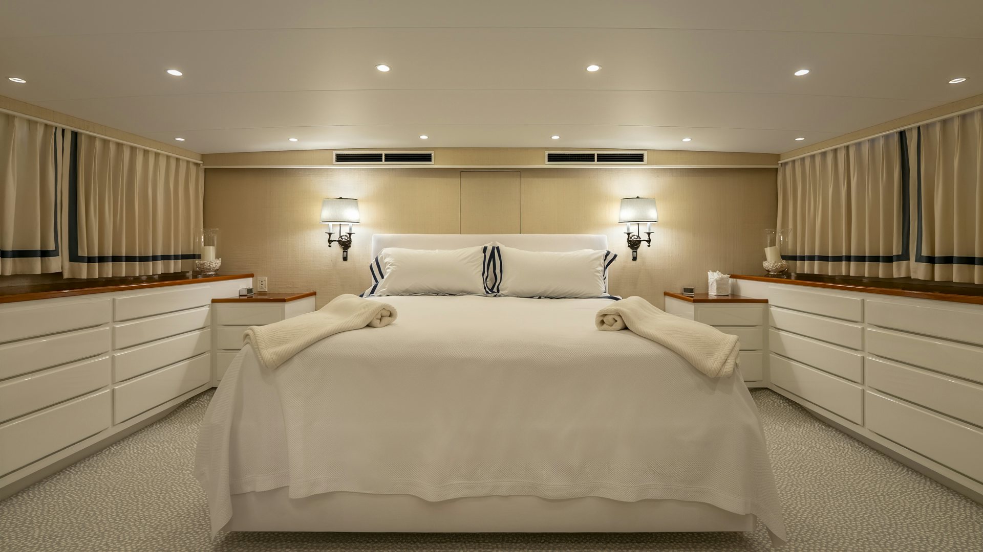 a room with a bed and a desk aboard STONEFACE Yacht for Sale