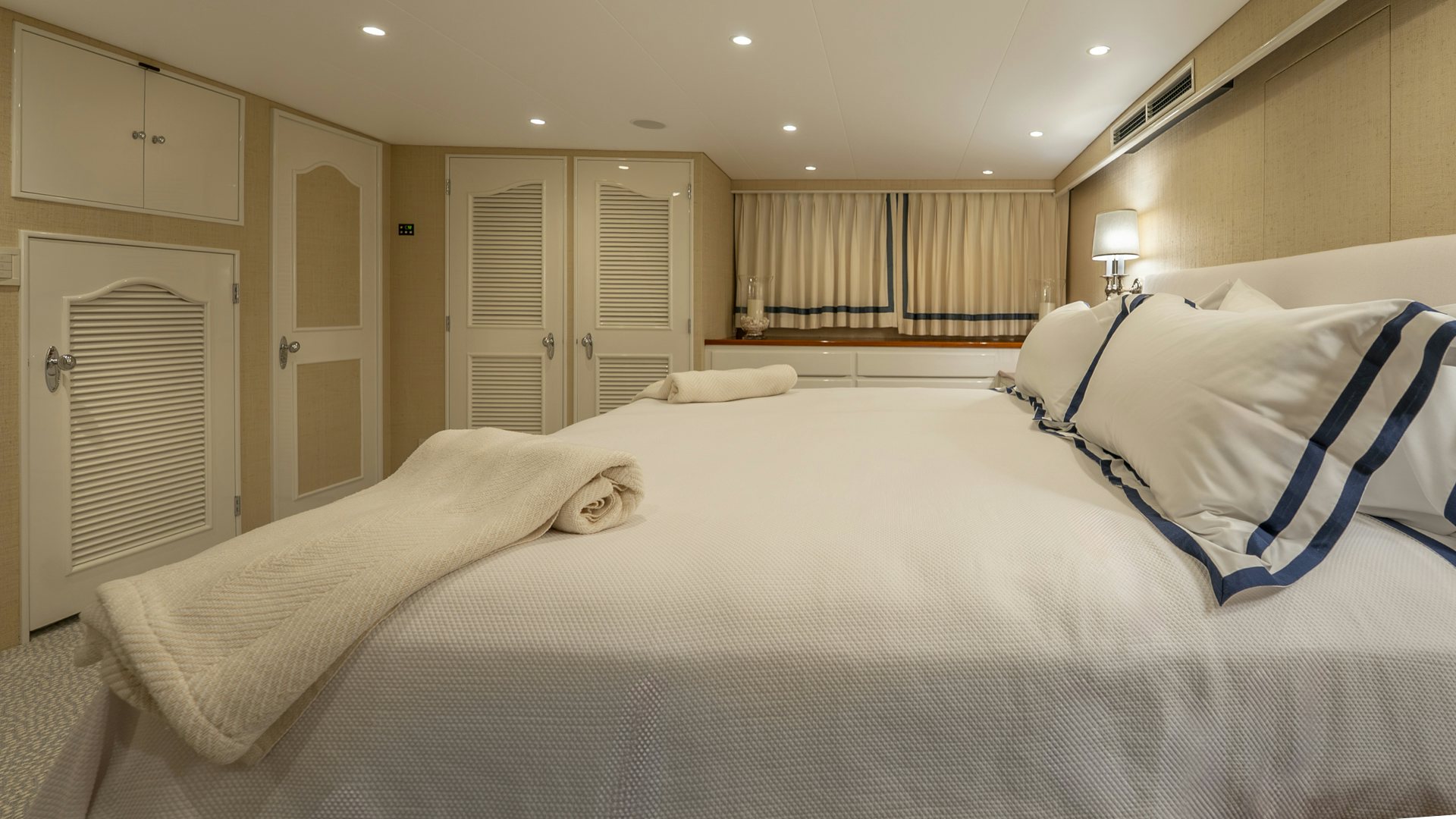 a cat lying on a bed aboard STONEFACE Yacht for Sale
